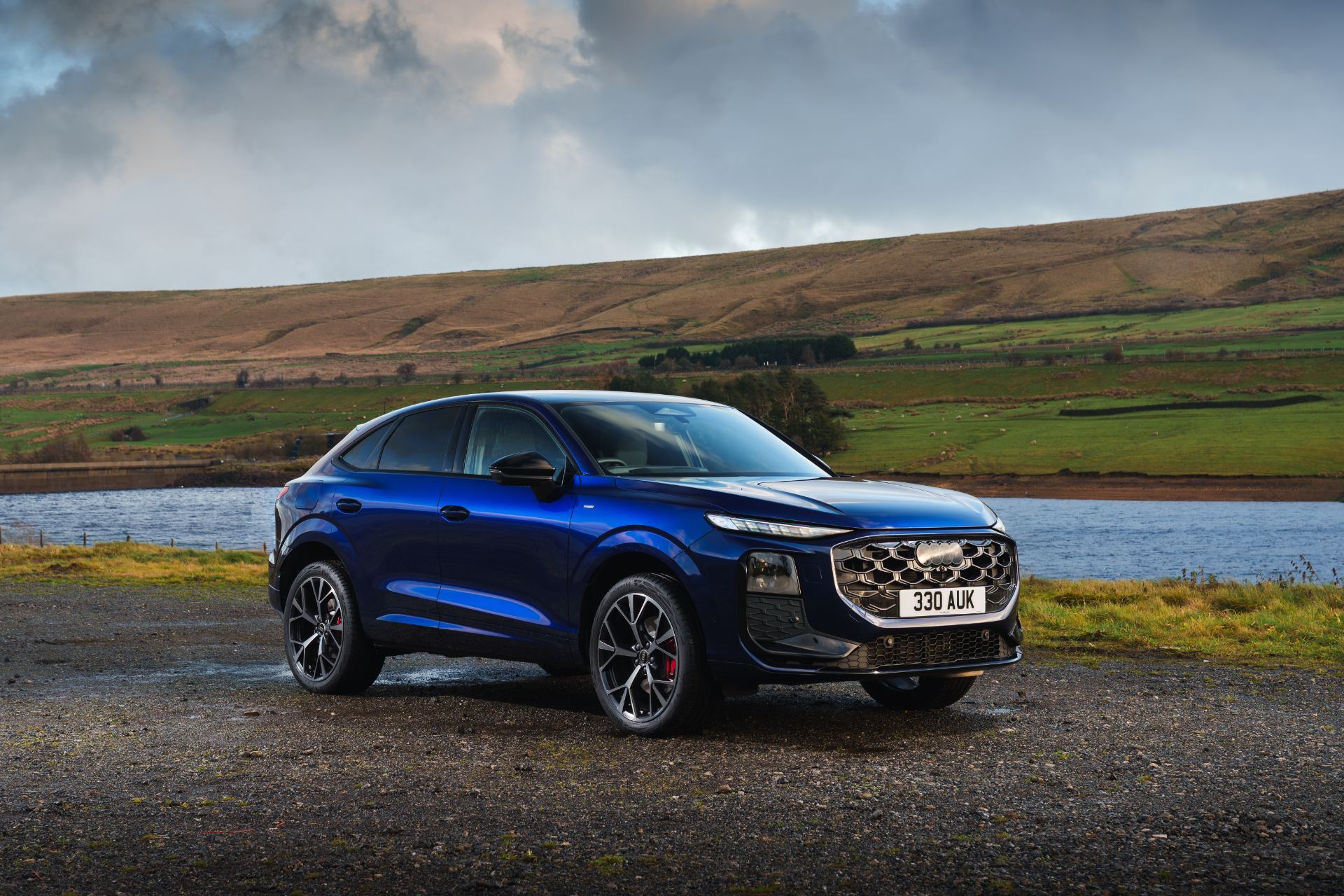 2026 audi q3 sportback e hybrid front three quarter reservoir blue