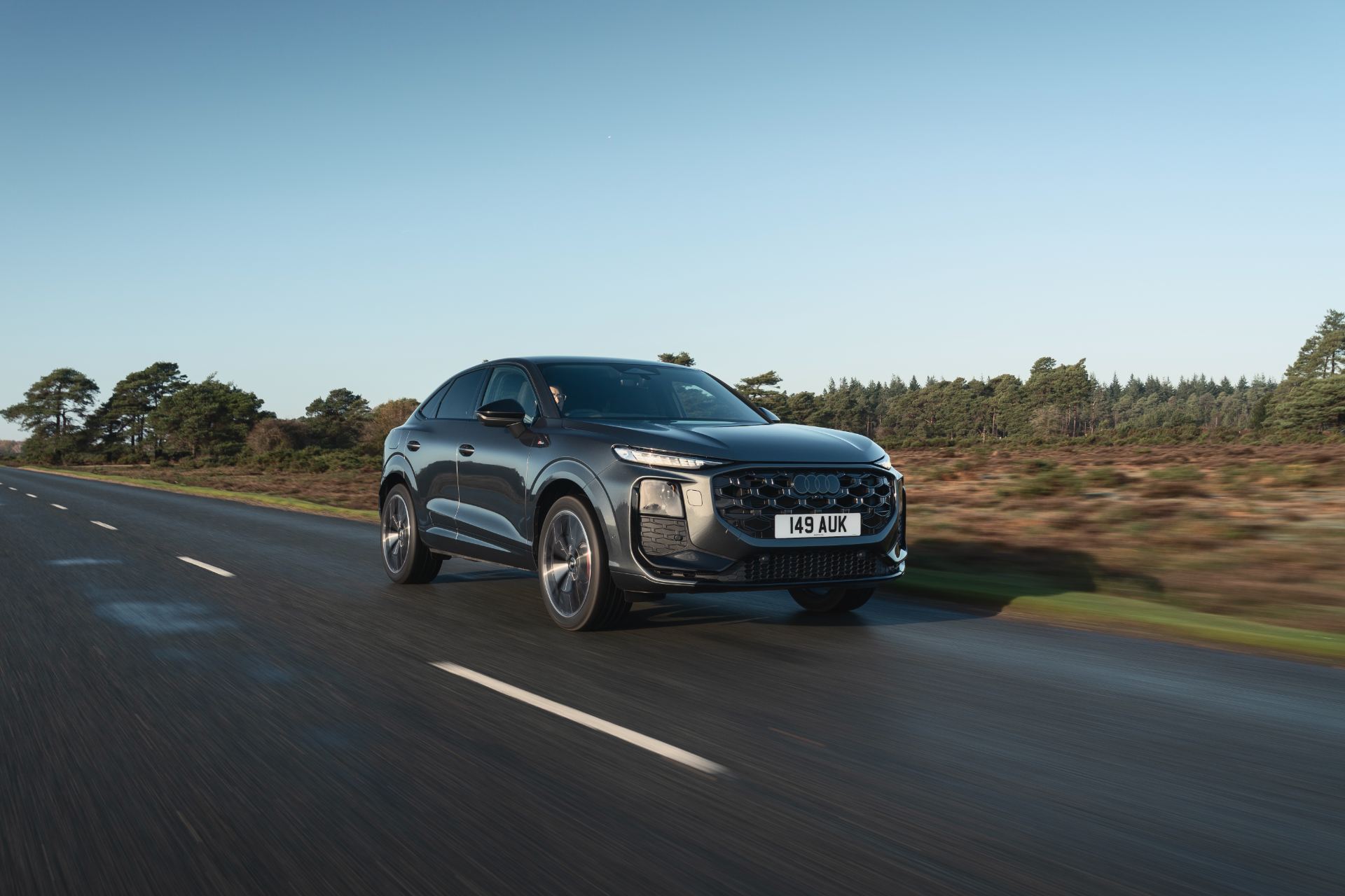 2026 audi q3 sportback driving front three quarter grey