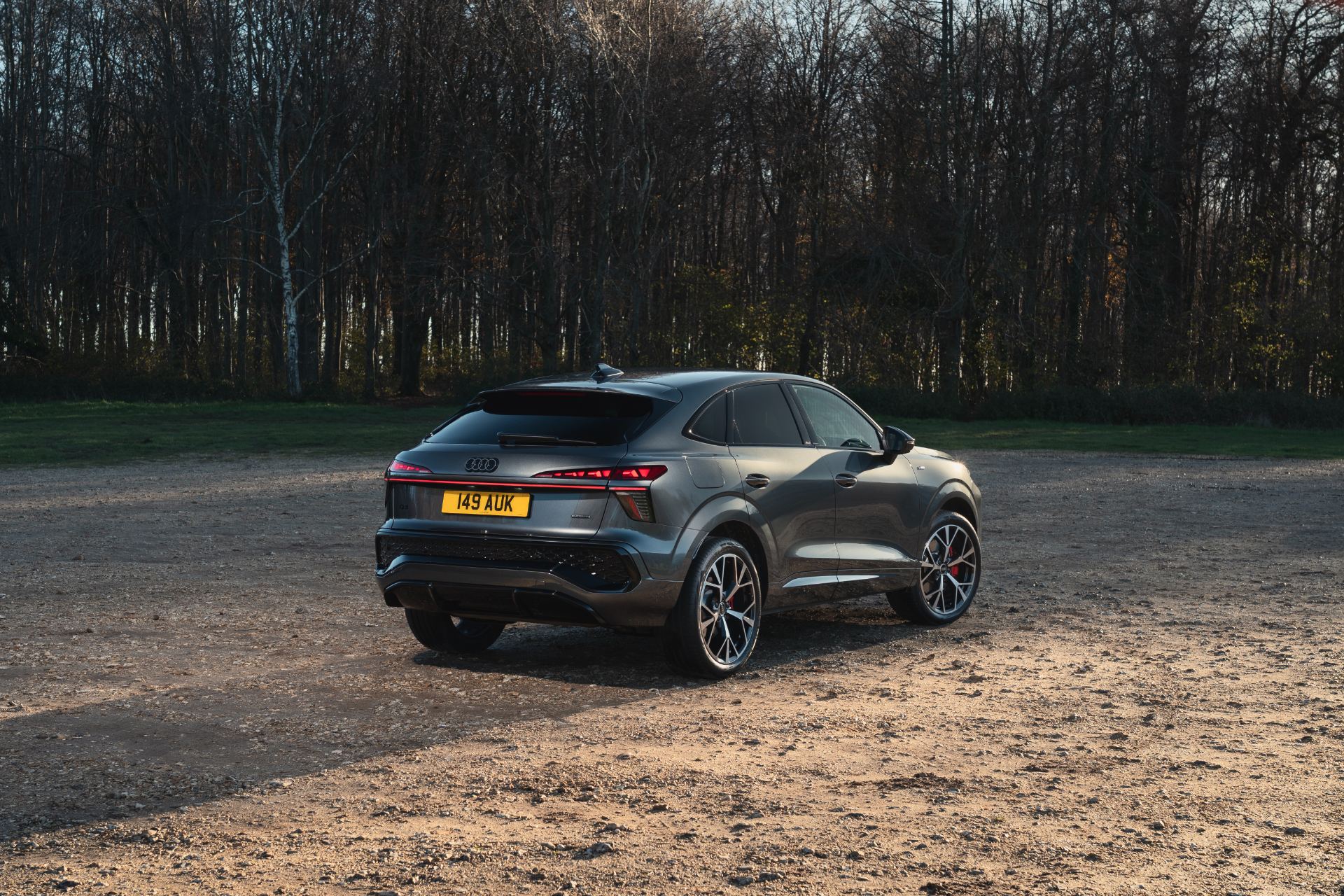 2026 audi q3 sportback rear three quarter forest clearing grey