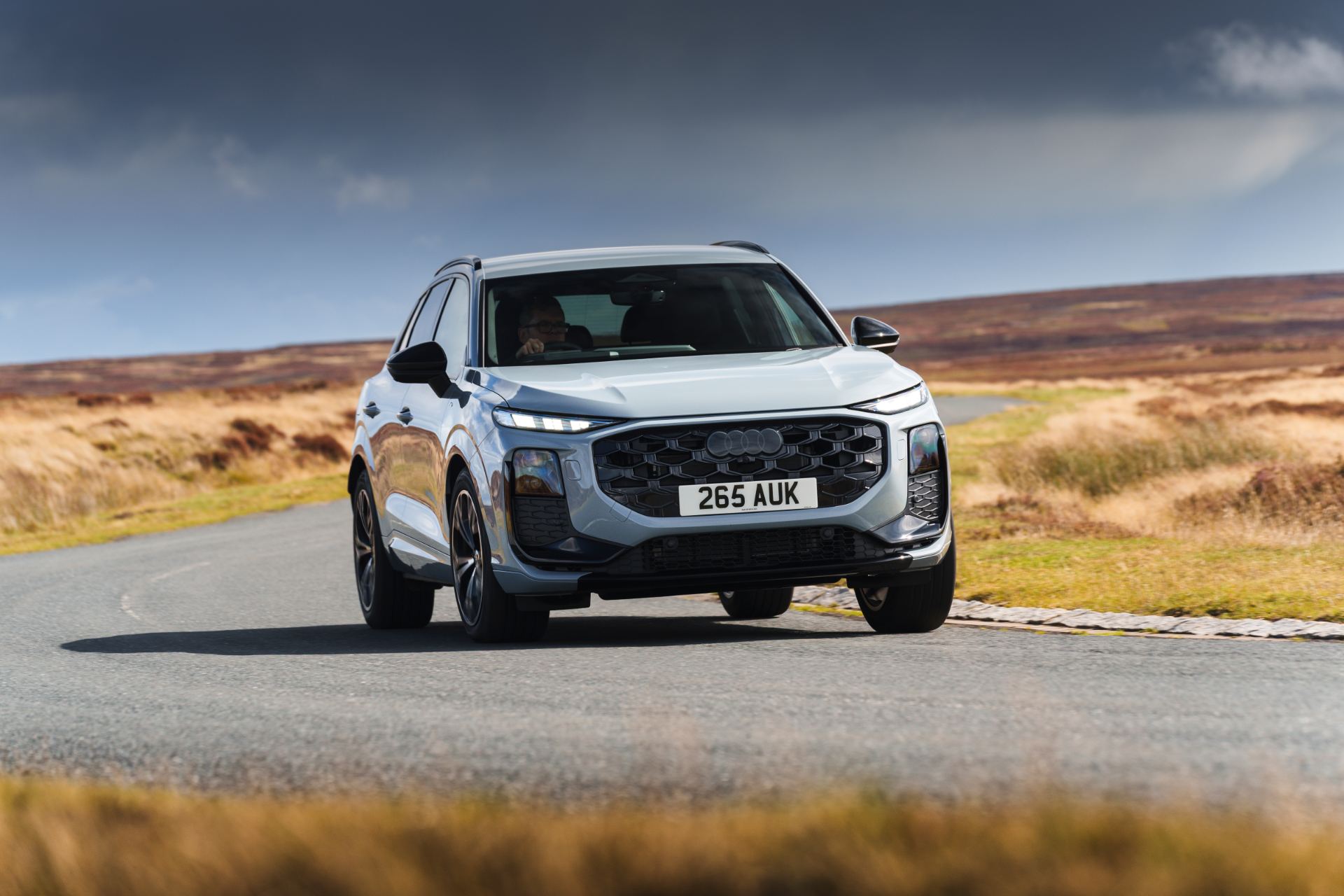 2026 audi q3 driving front three quarter corner silver