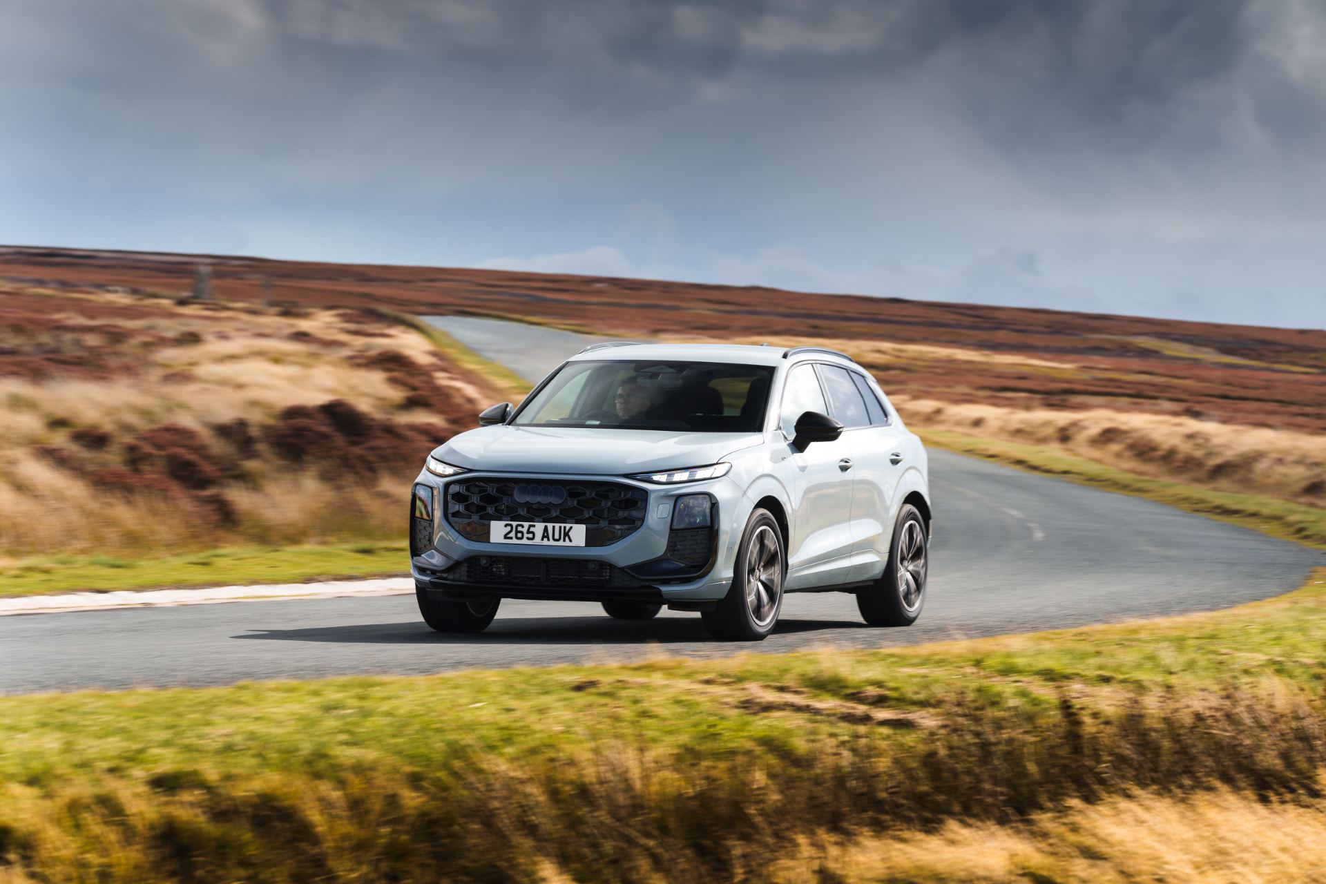 2026 audi q3 driving front three quarter hairpin silver