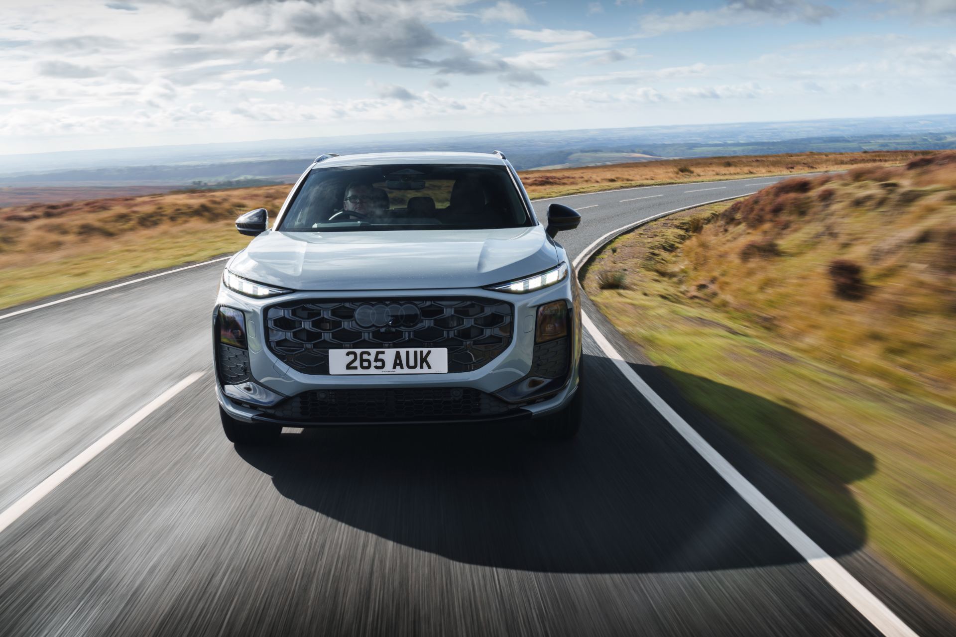 2026 audi q3 driving front moorland road silver