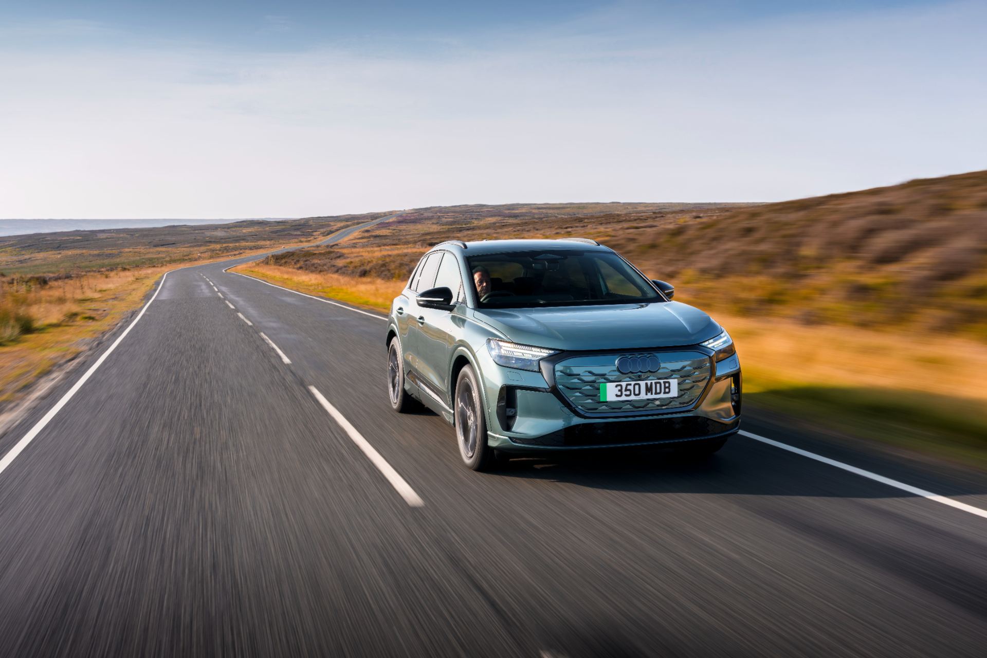 2026 audi q4 e tron driving front three quarter green