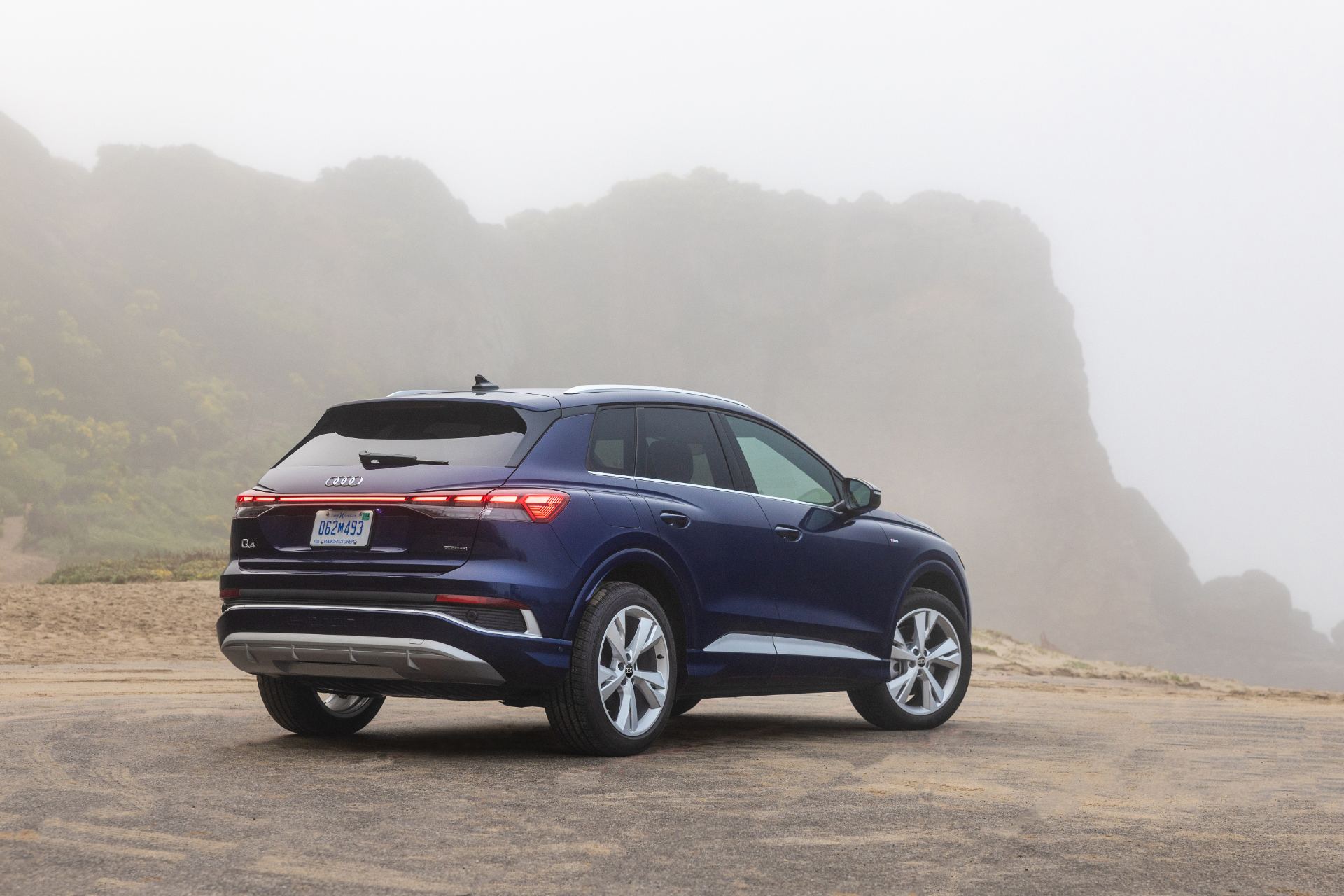 2026 audi q4 e tron rear three quarter fog blue