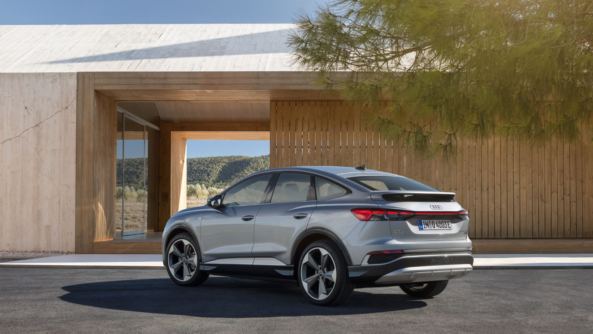 2026 audi q4 sportback e tron rear three quarter architecture silver