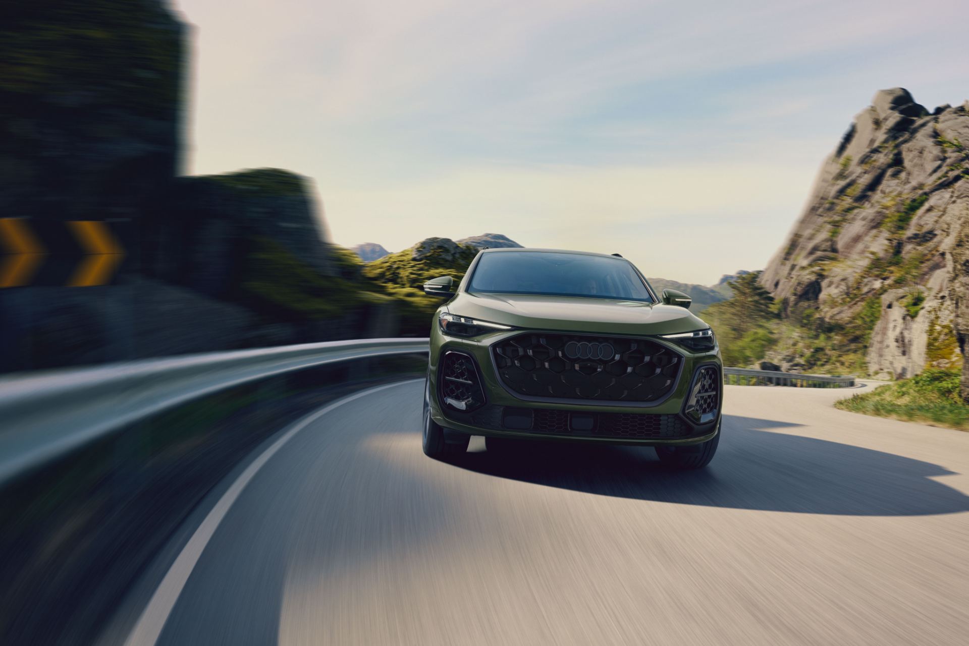 2026 audi q5 driving front coastal road green