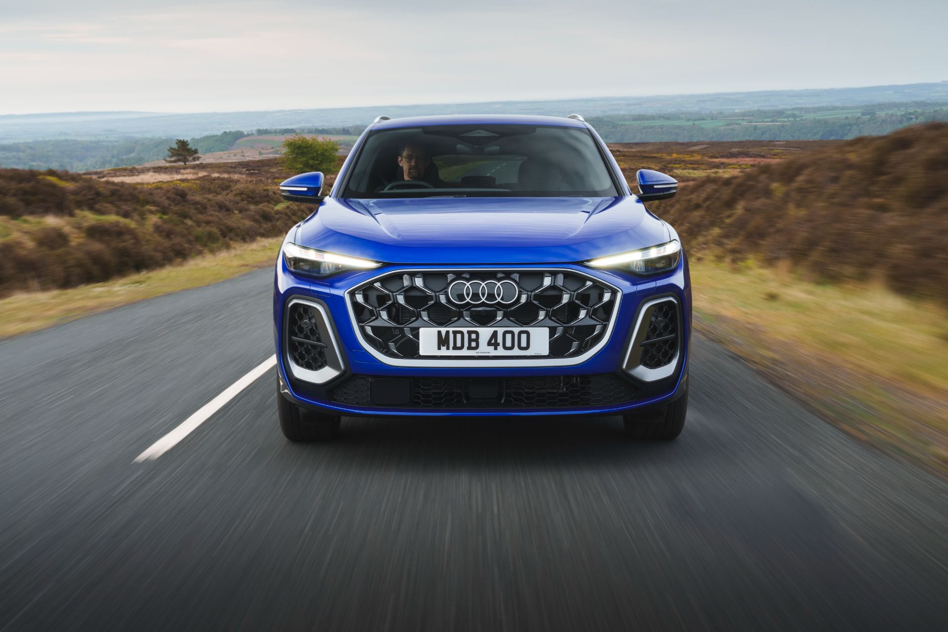 2026 audi q5 sportback e hybrid driving front blue