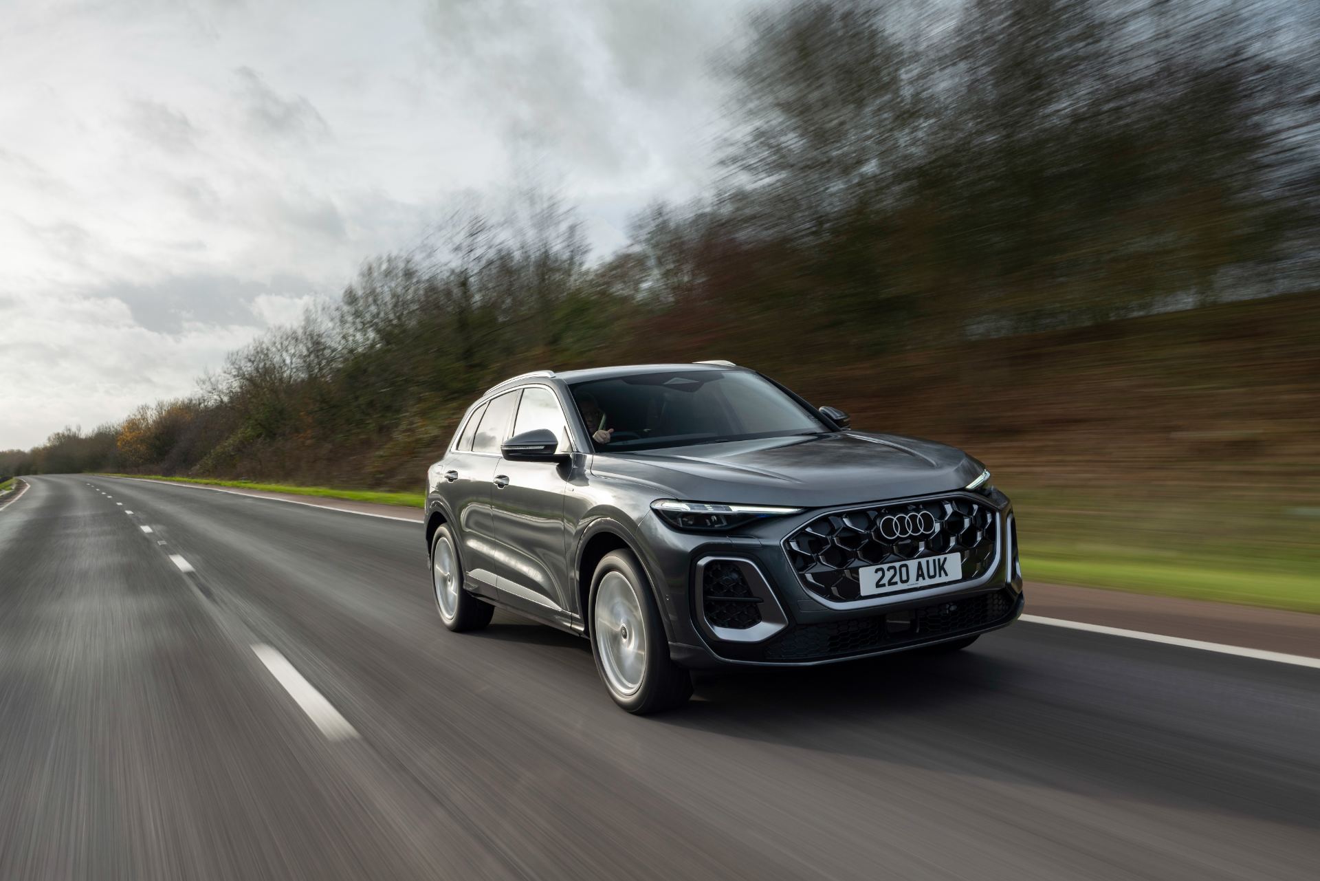 2026 audi q5 suv e hybrid driving front three quarter grey