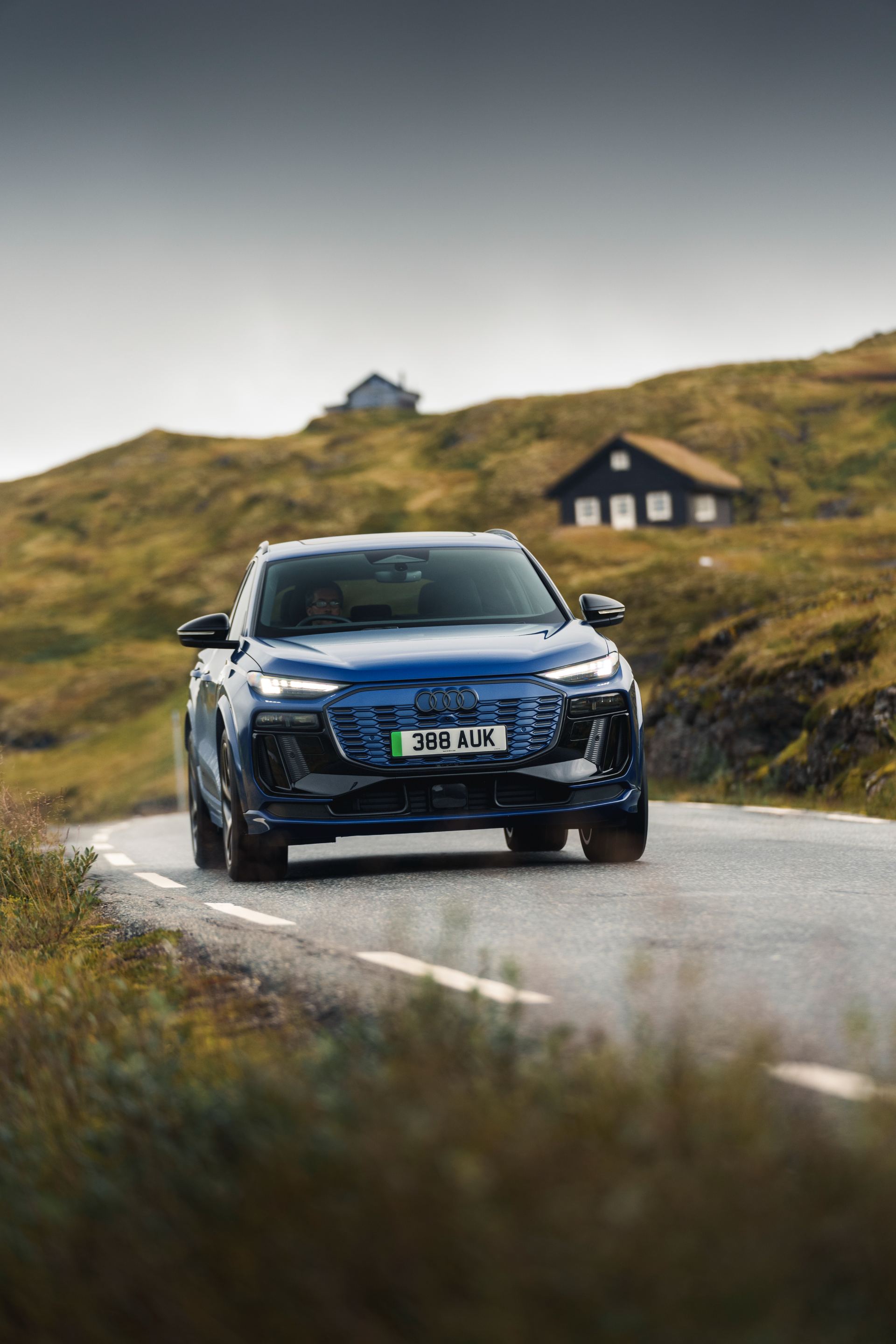 2026 audi q6 e tron driving front blue
