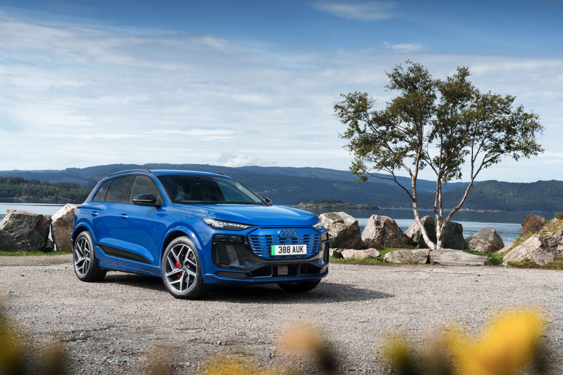 2026 audi q6 e tron front three quarter blue