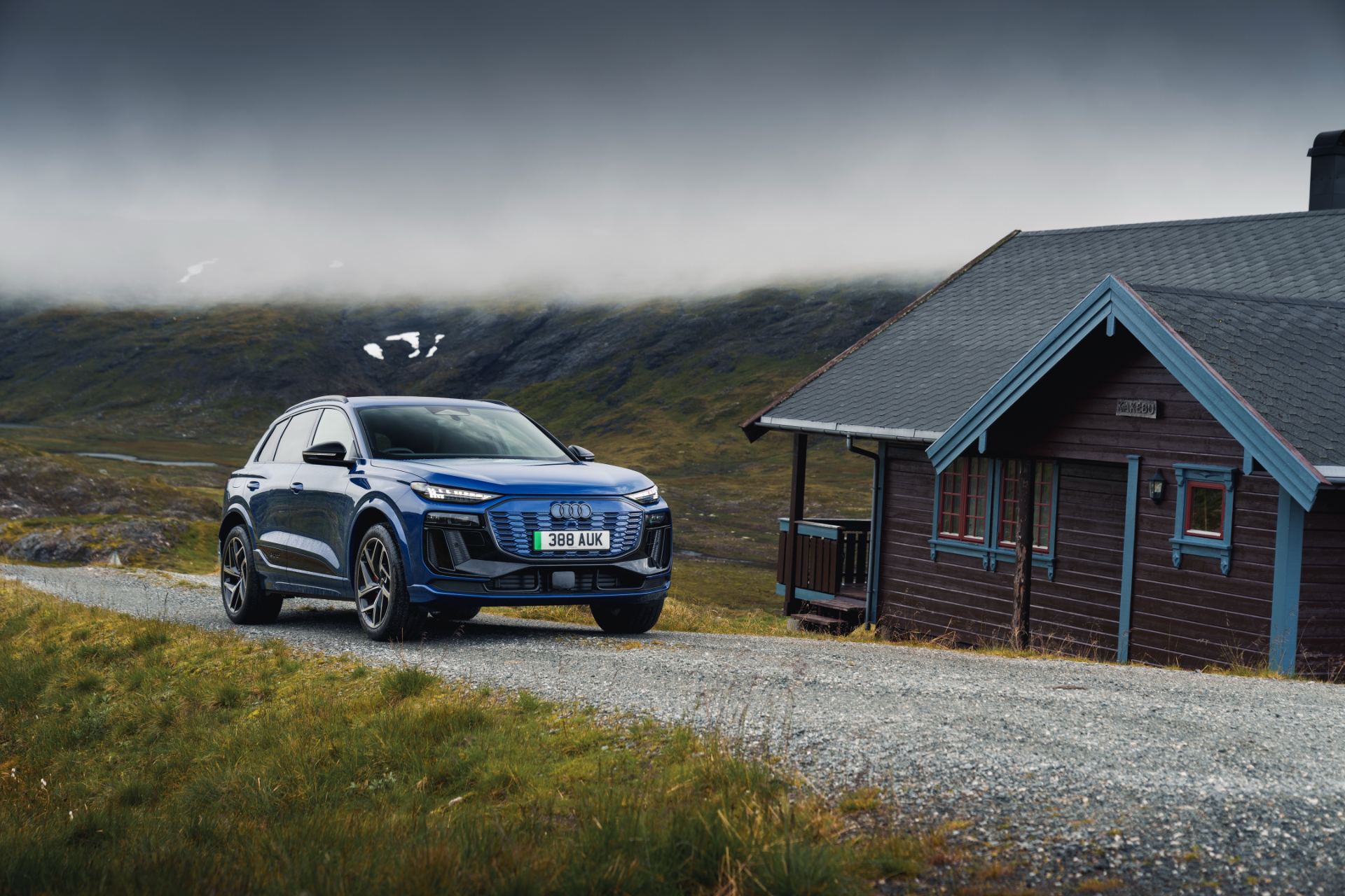2026 audi q6 e tron front three quarter cabin blue