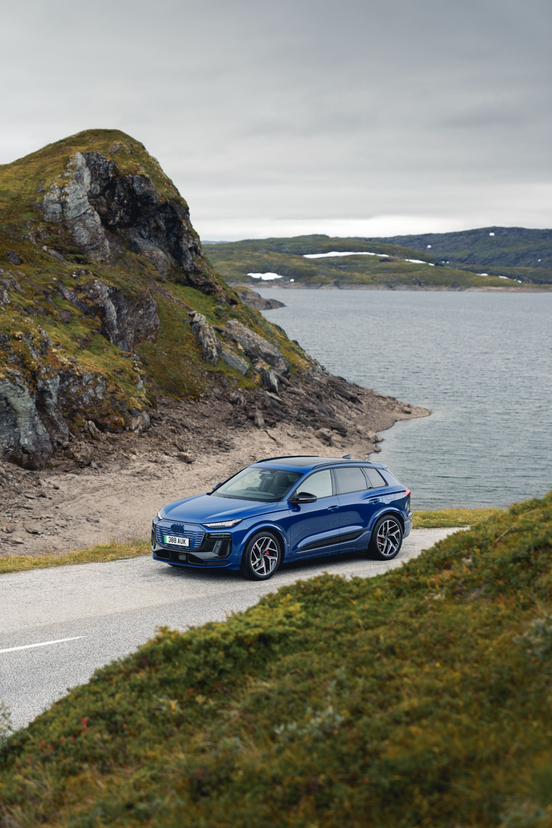 2026 audi q6 e tron front three quarter elevated blue