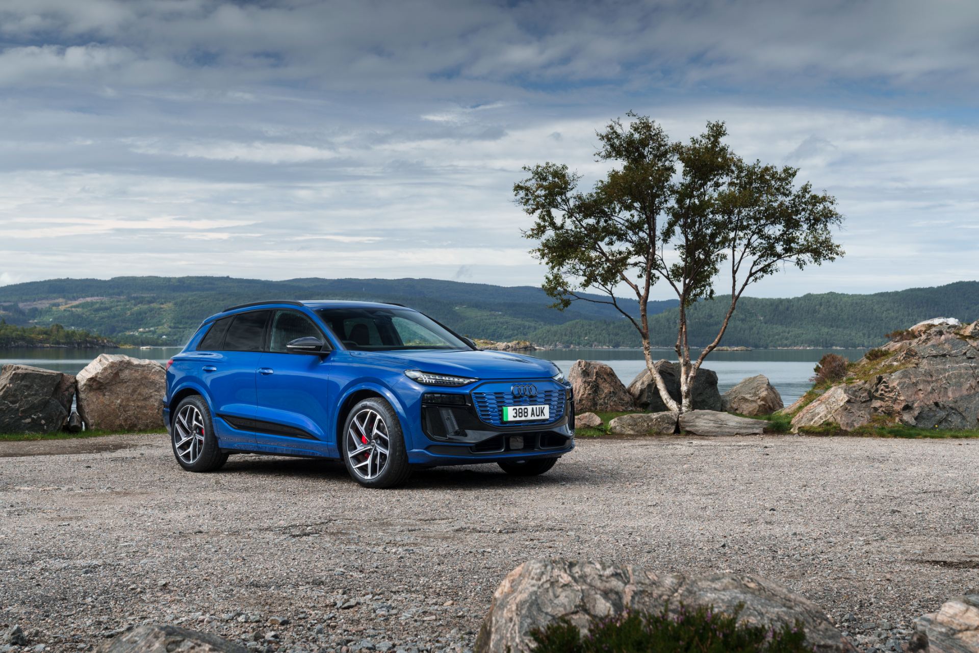 2026 audi q6 e tron front three quarter tree blue