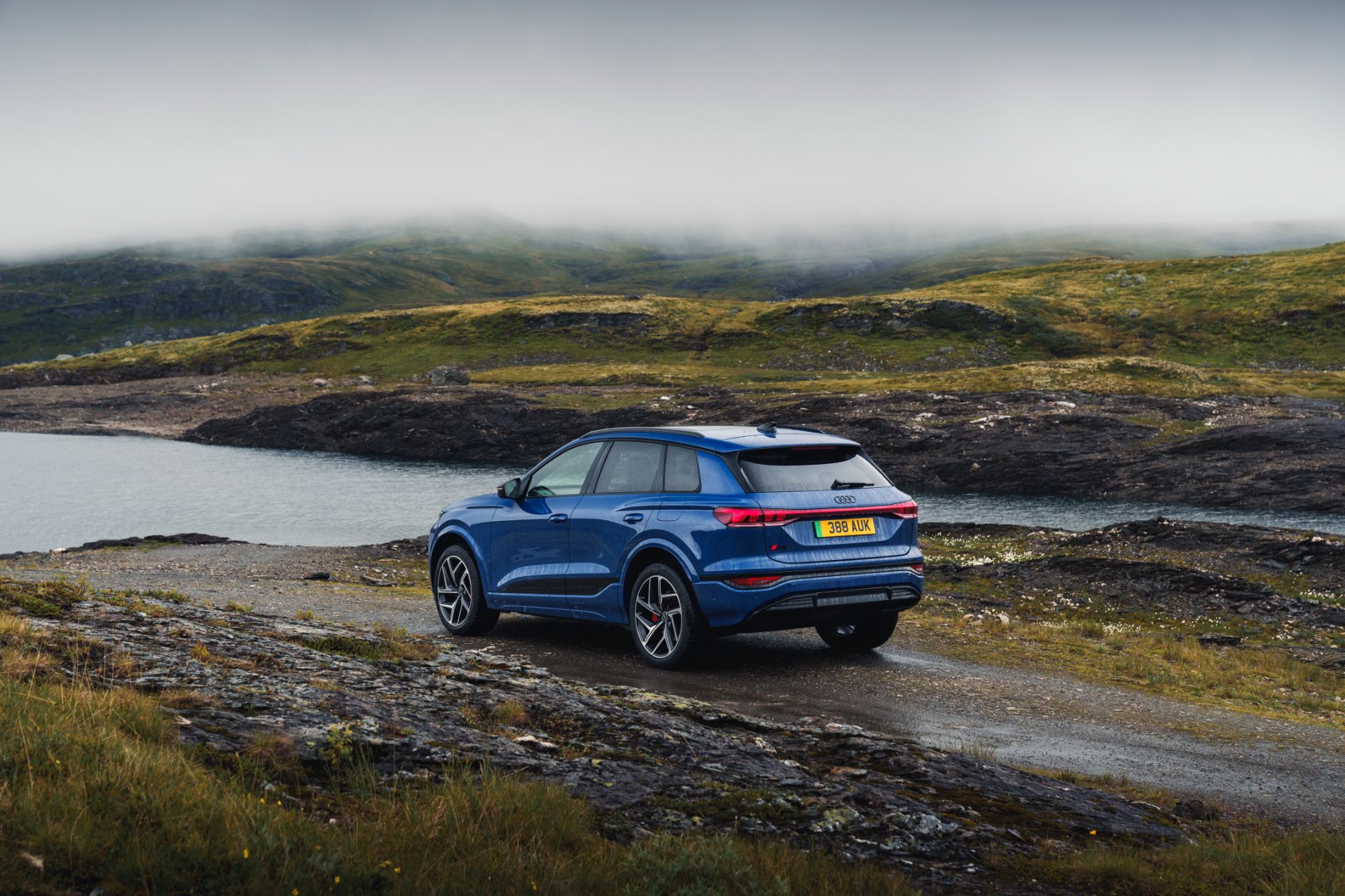 2026 audi q6 e tron rear three quarter mist blue