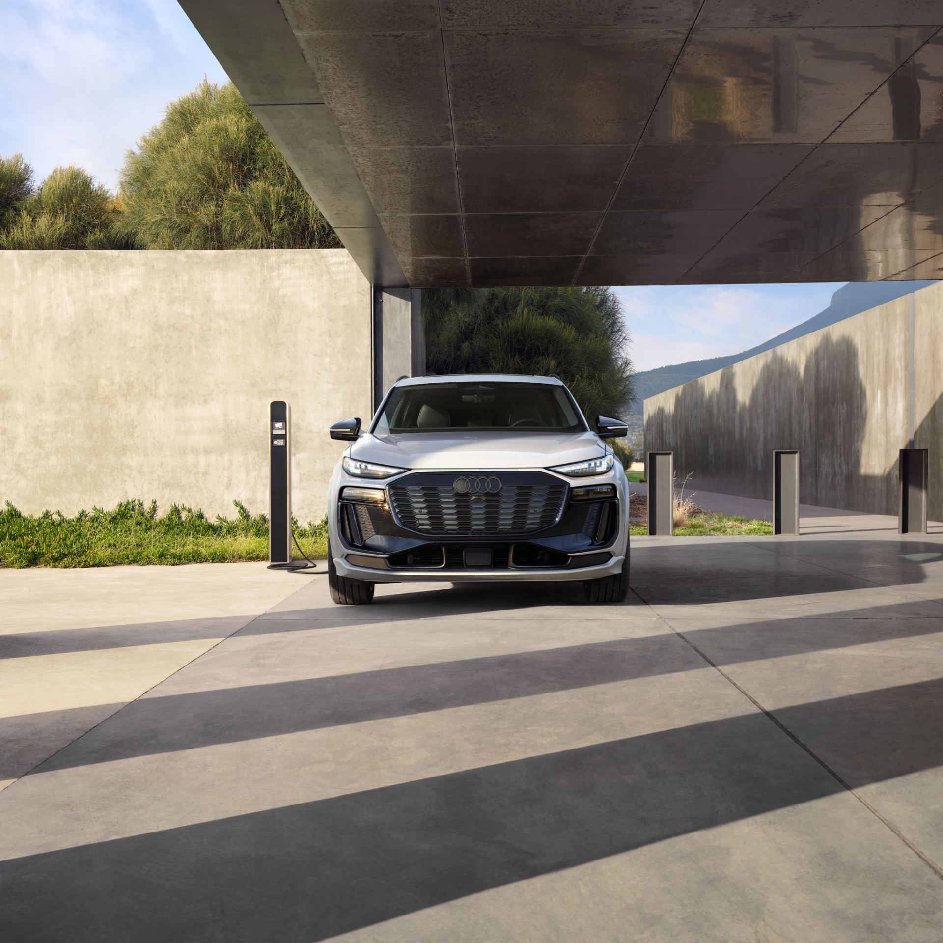 2027 audi q6 e tron front charging carport white