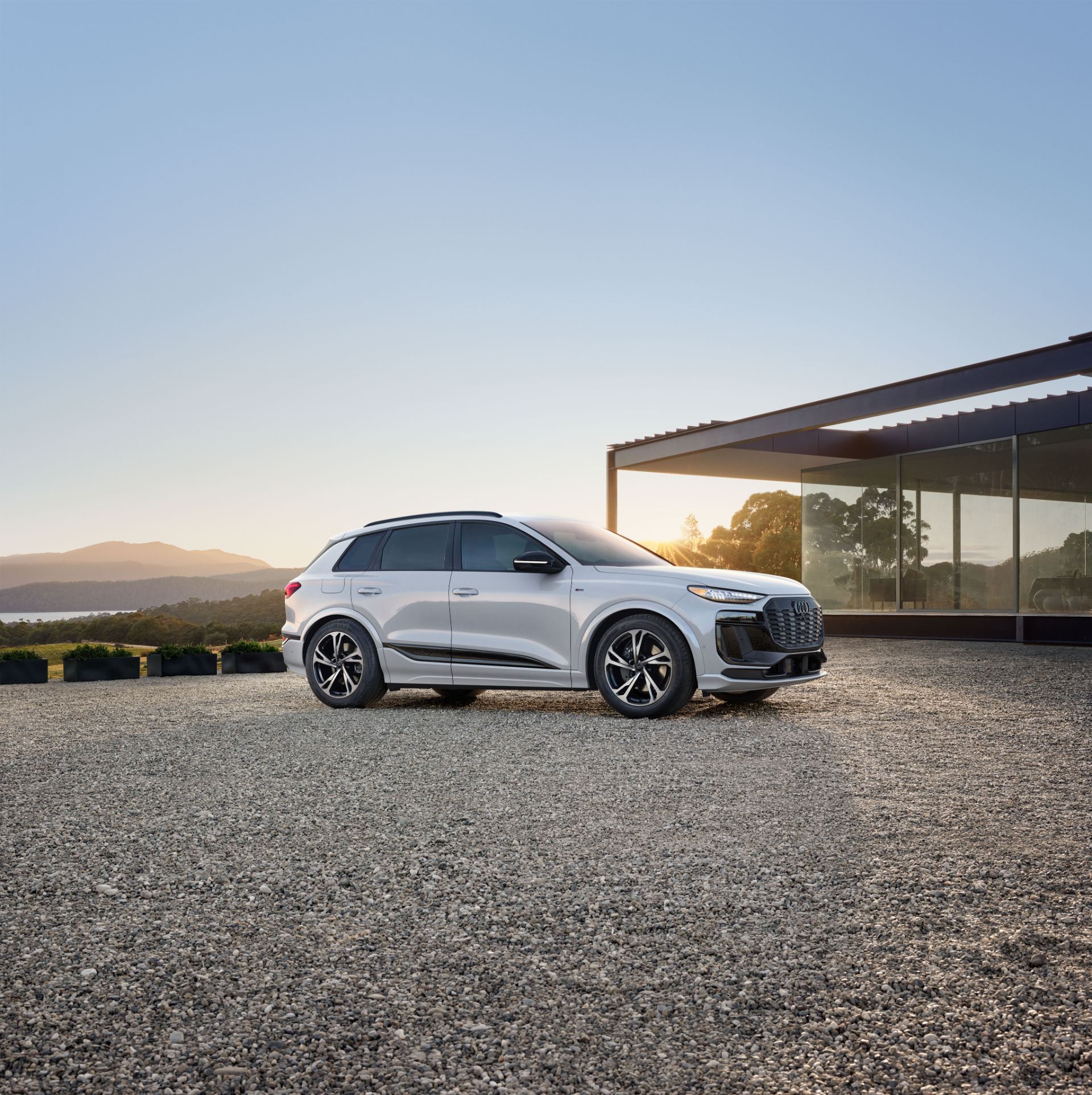 2027 audi q6 e tron side profile modern house white
