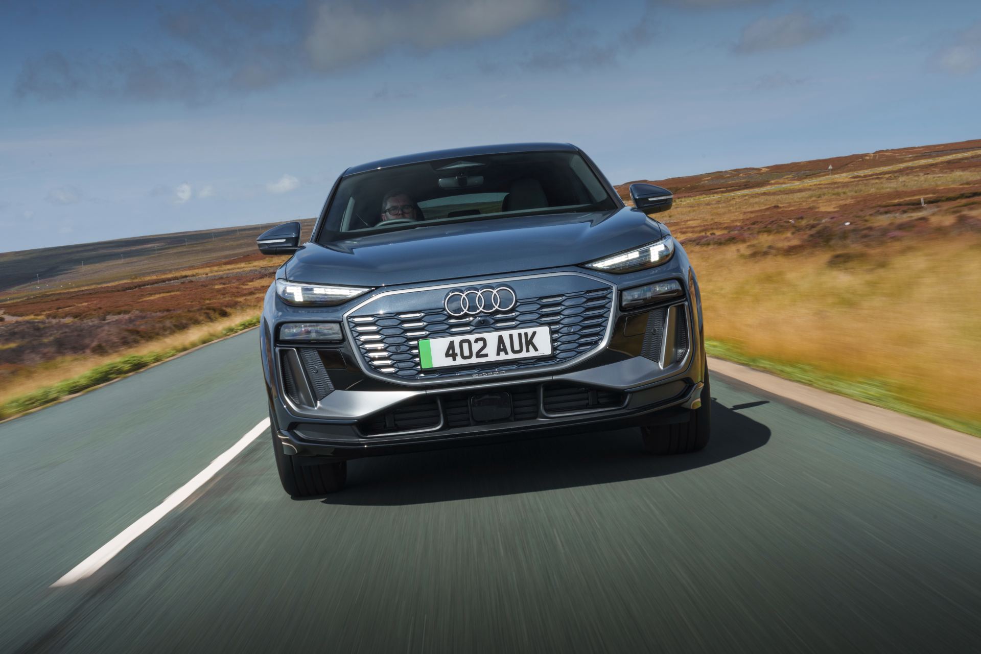 2026 audi q6 sportback e tron driving front grey