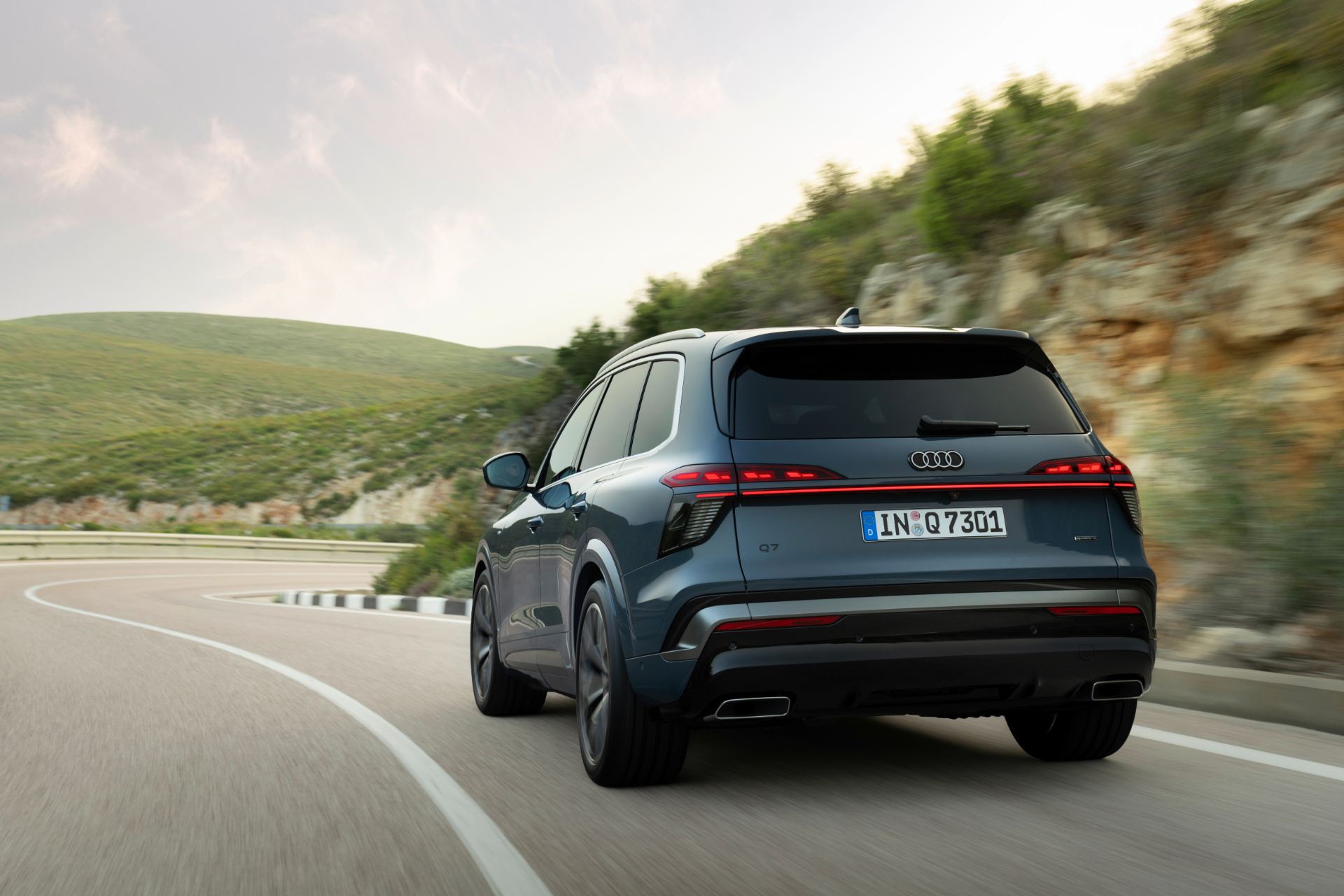 2027 audi q7 driving rear coastal road blue