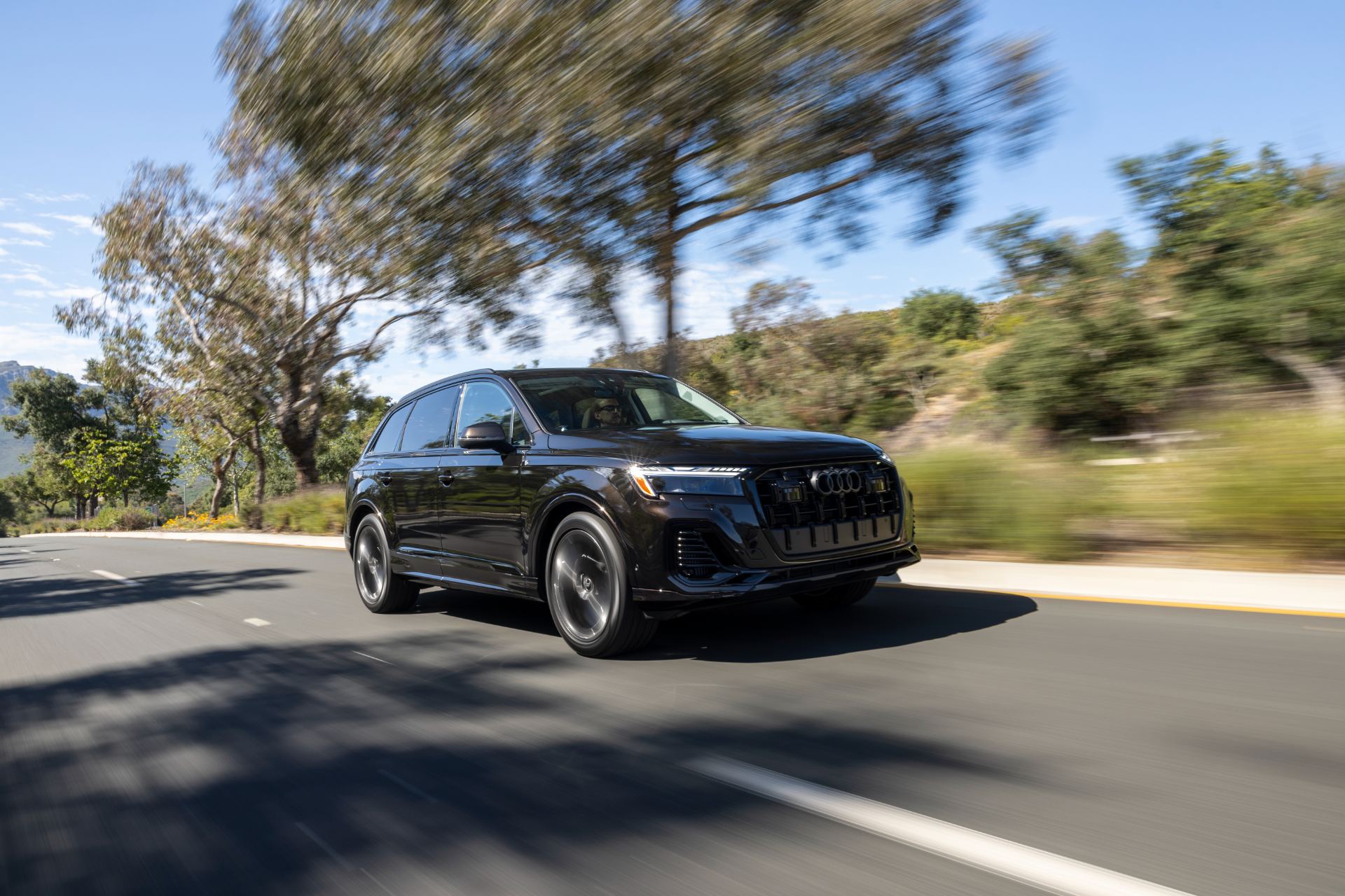 2026 audi q7 driving front three quarter blue