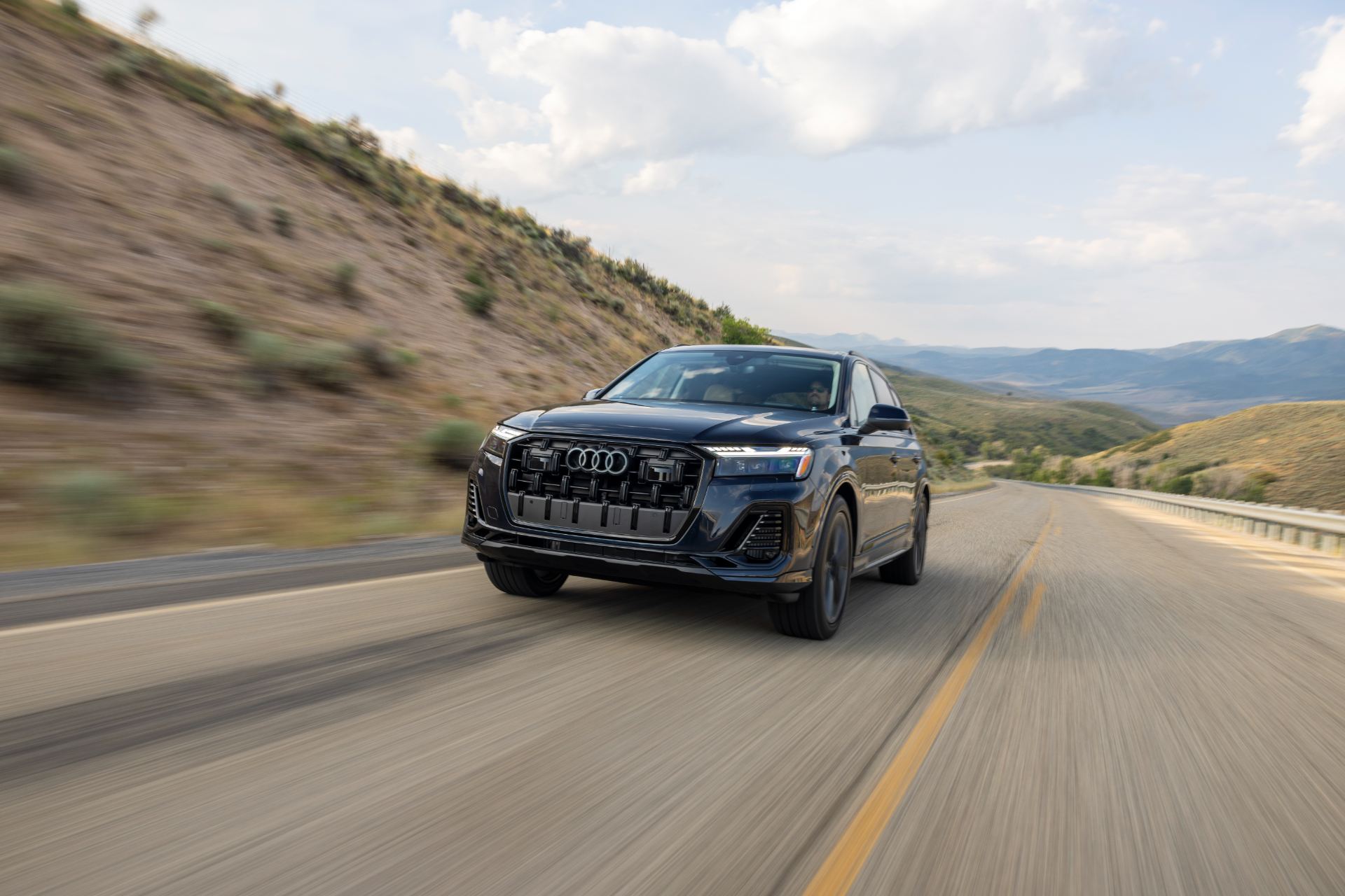 2026 audi q7 driving front highway blue