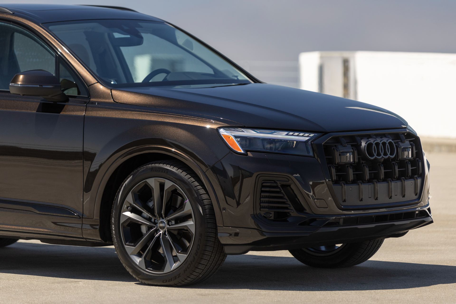 2026 audi q7 front three quarter parking deck brown