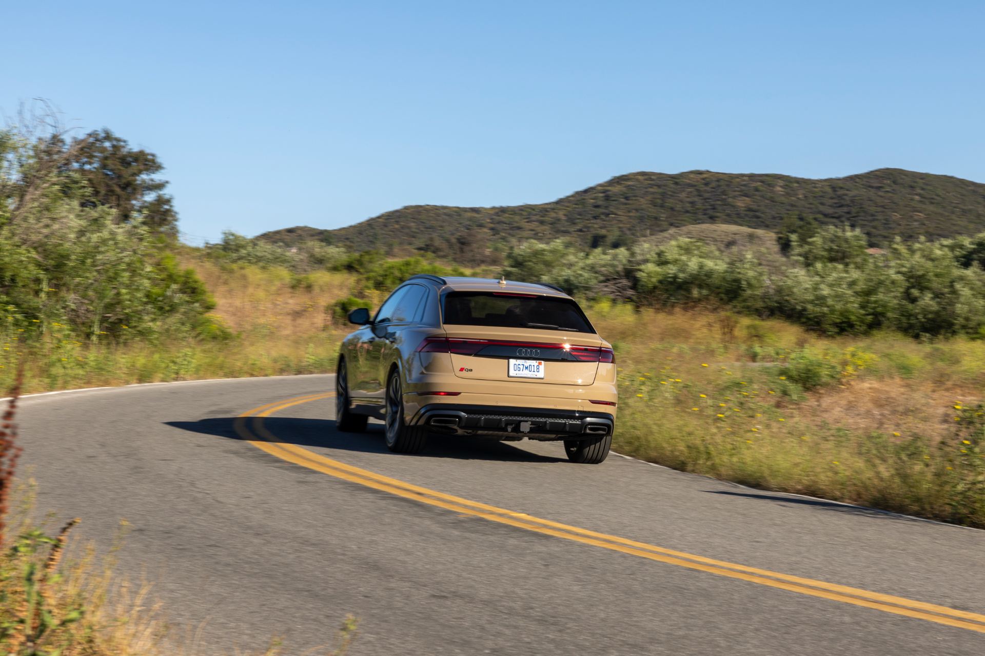 2027 audi q8 driving rear bend beige