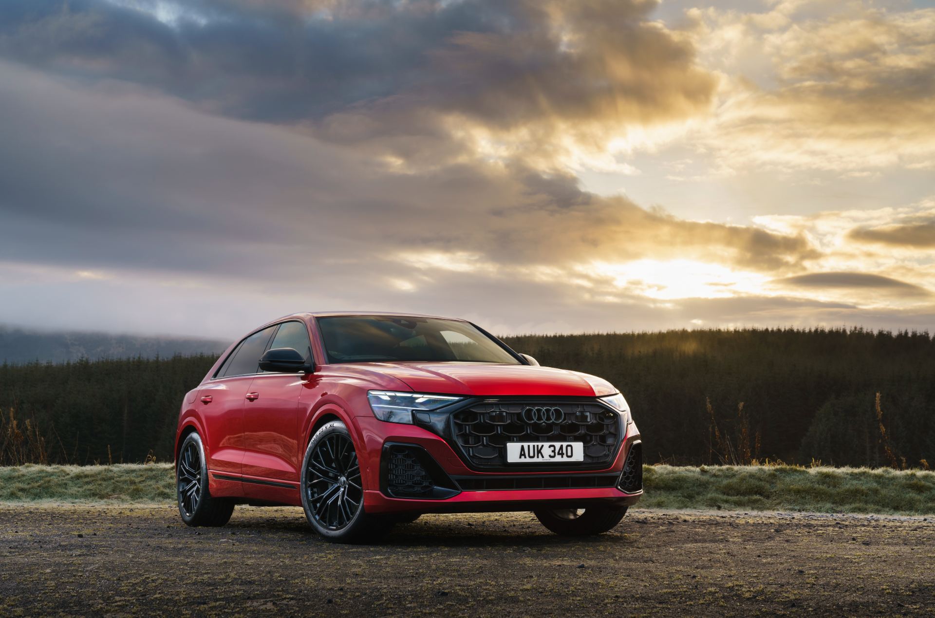 2026 audi q8 suv front three quarter sunset red