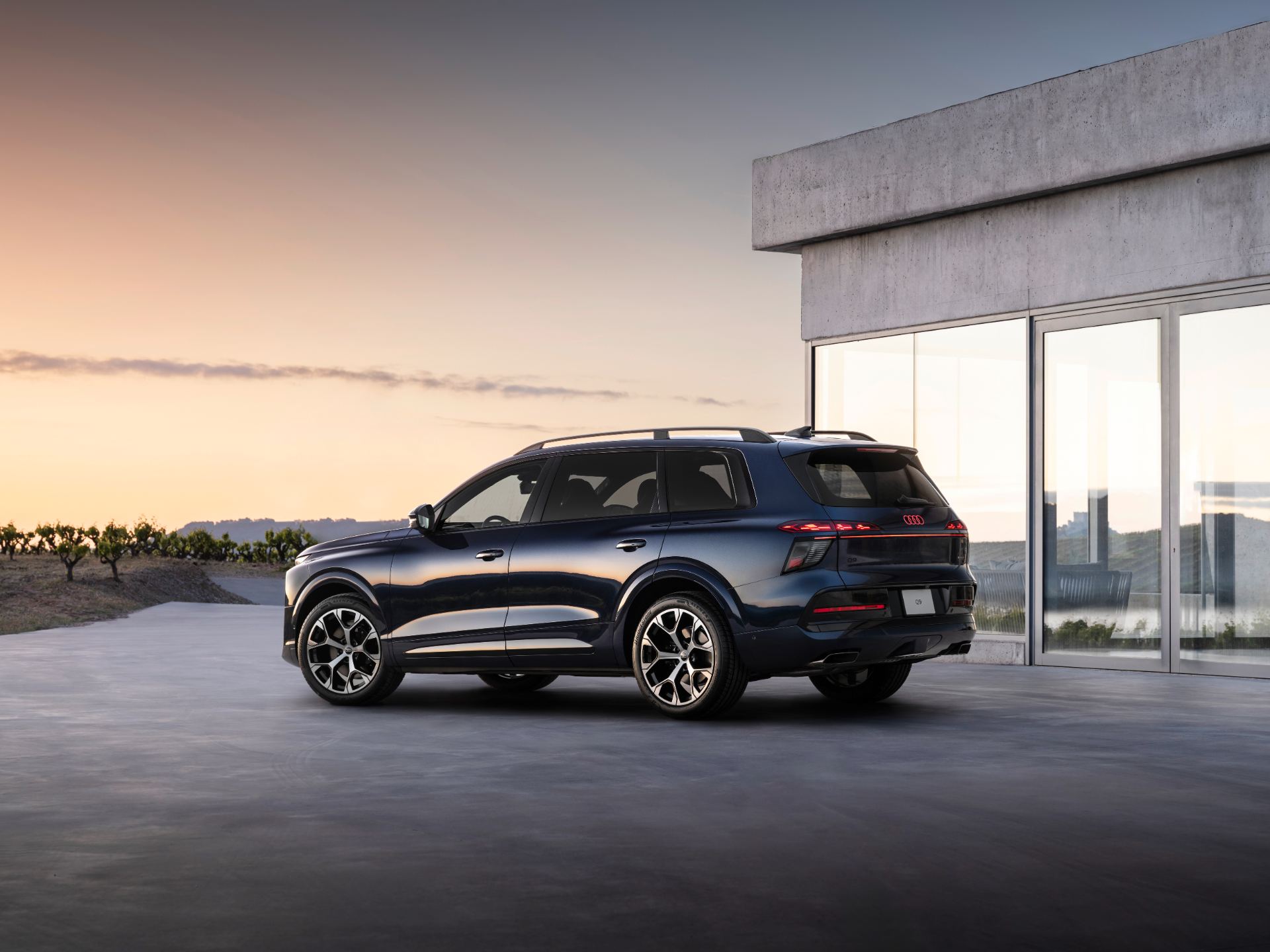 2026 audi q9 rear three quarter building blue