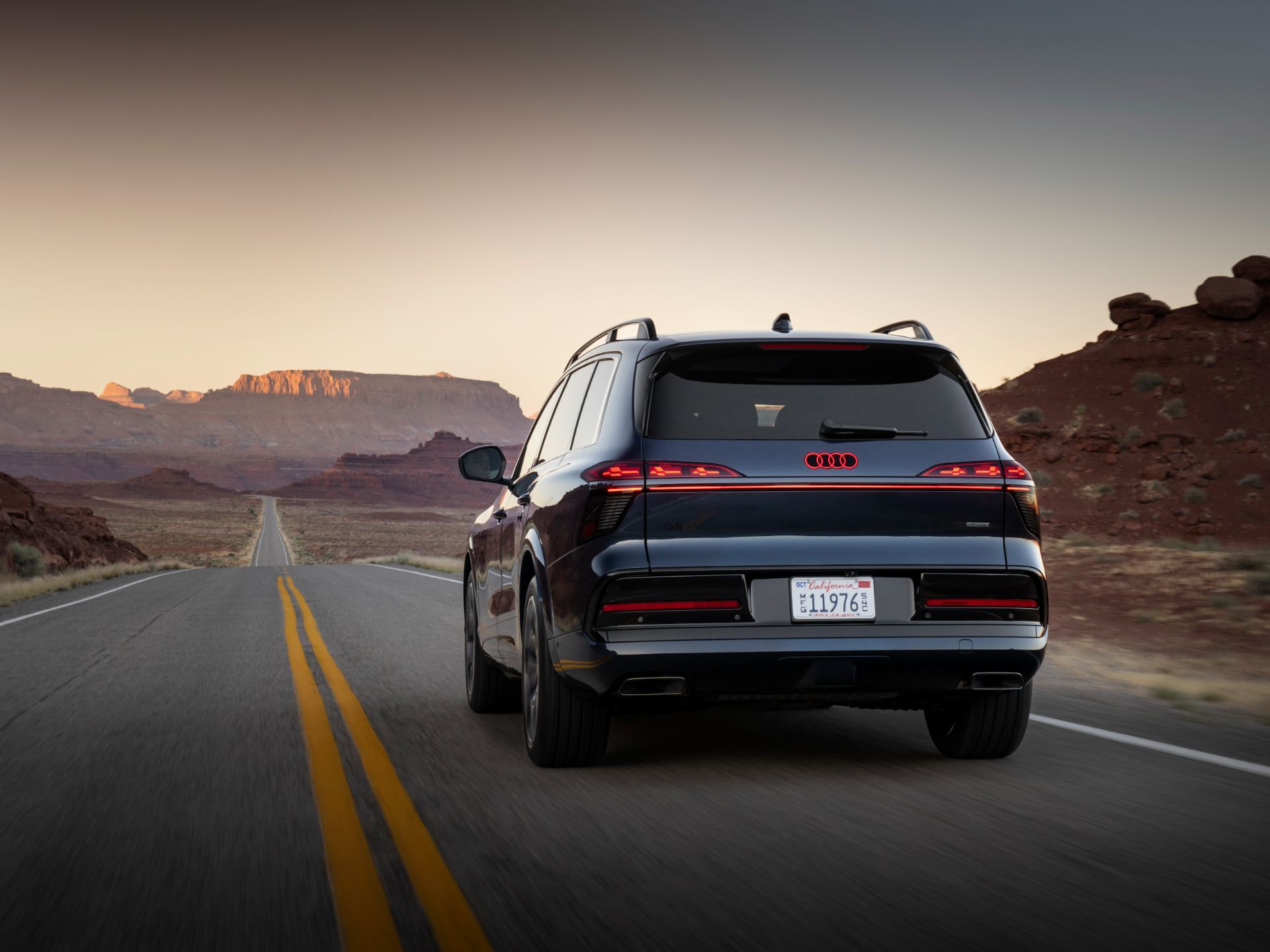 2027 audi q9 driving rear desert blue