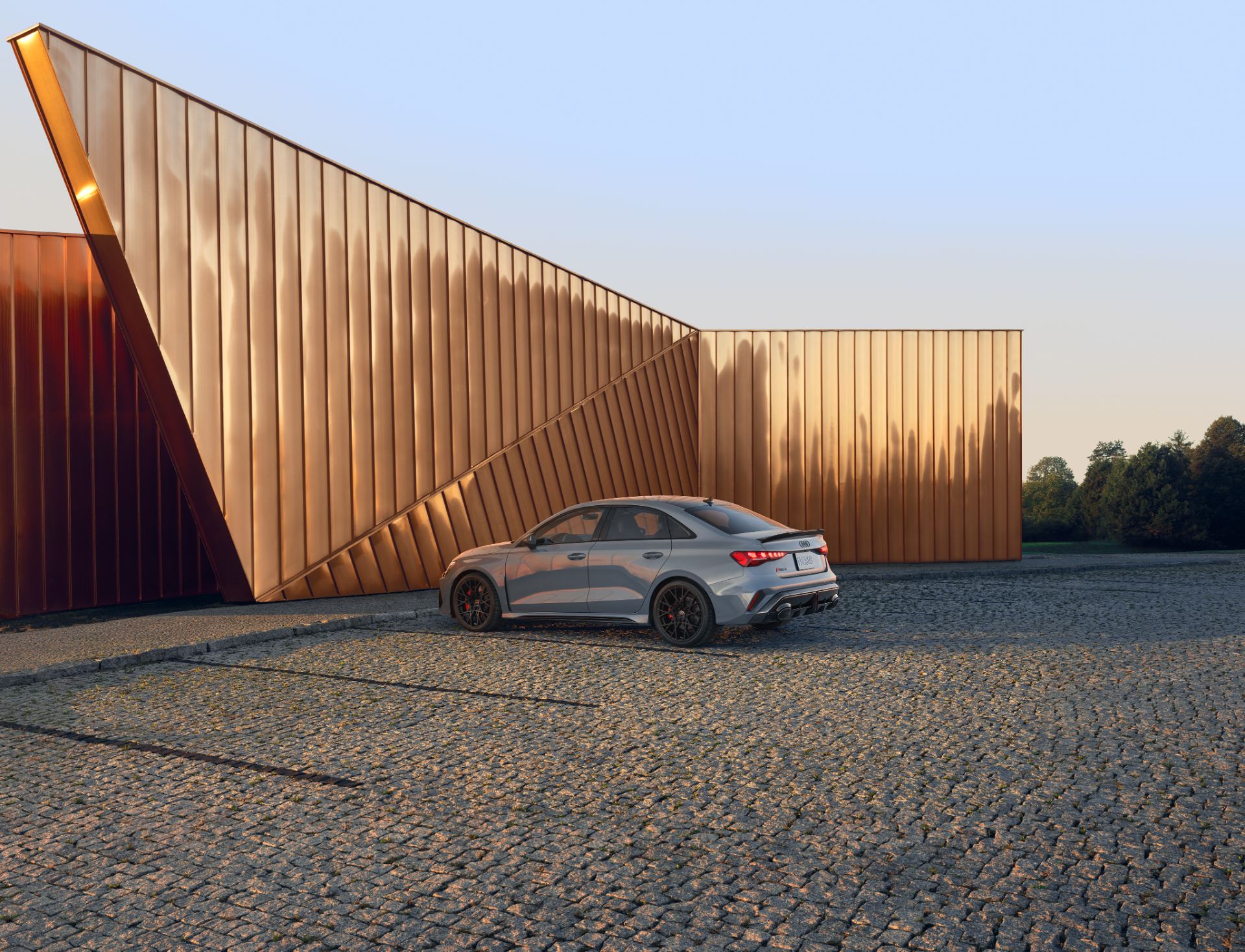 2027 audi rs 3 rear three quarter copper wall grey