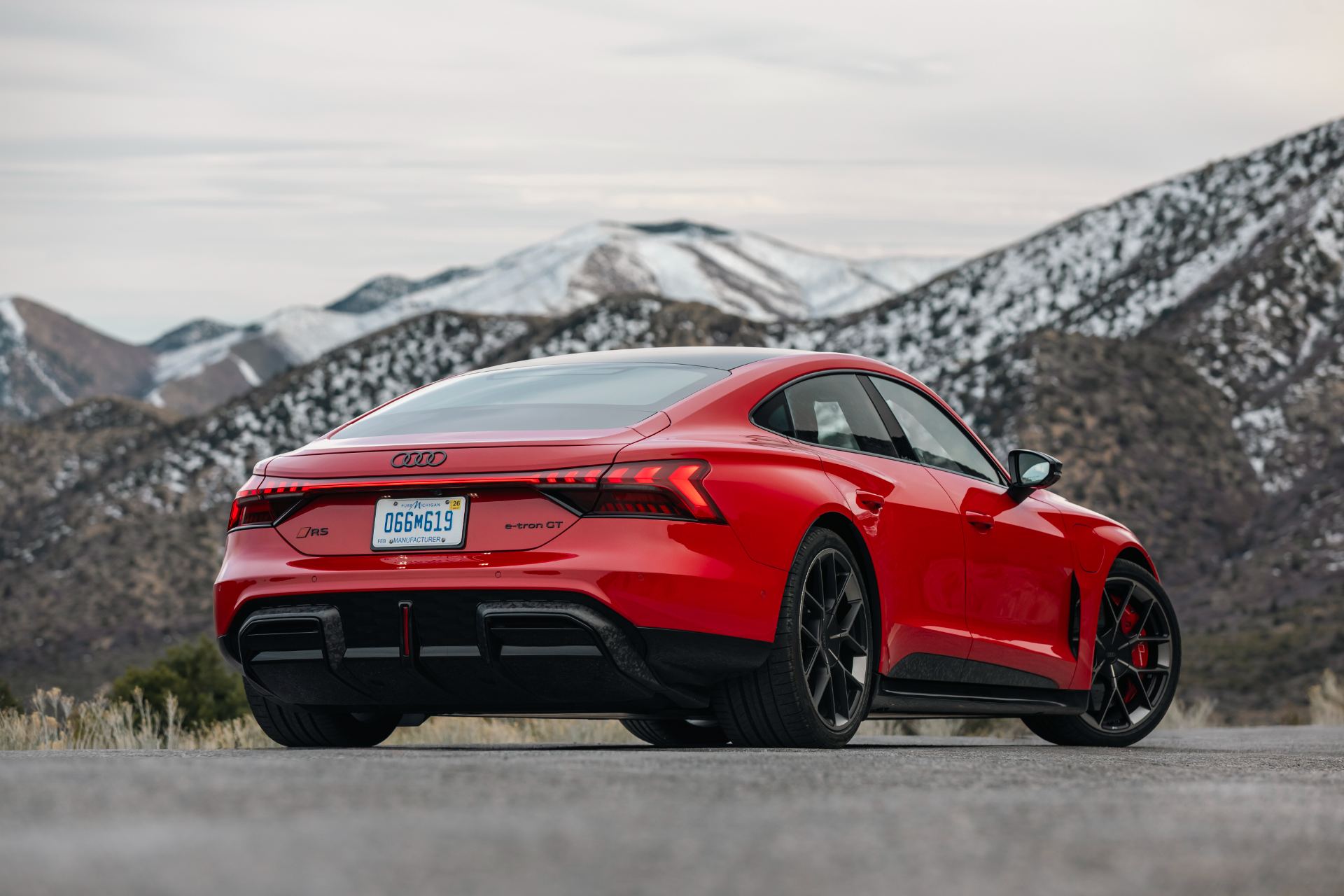 2026 audi rs e tron gt performance rear three quarter snowy mountains red