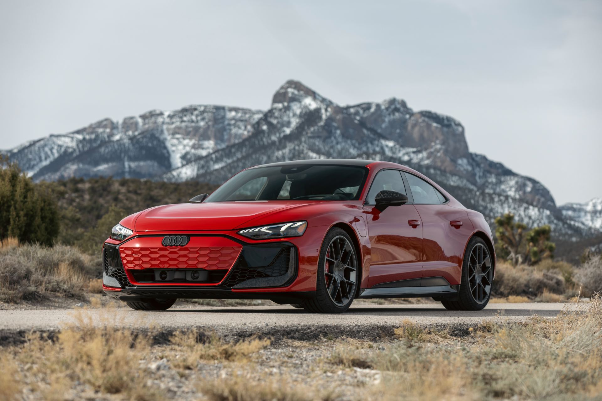 2026 audi rs e tron gt performance front three quarter snowy mountains red