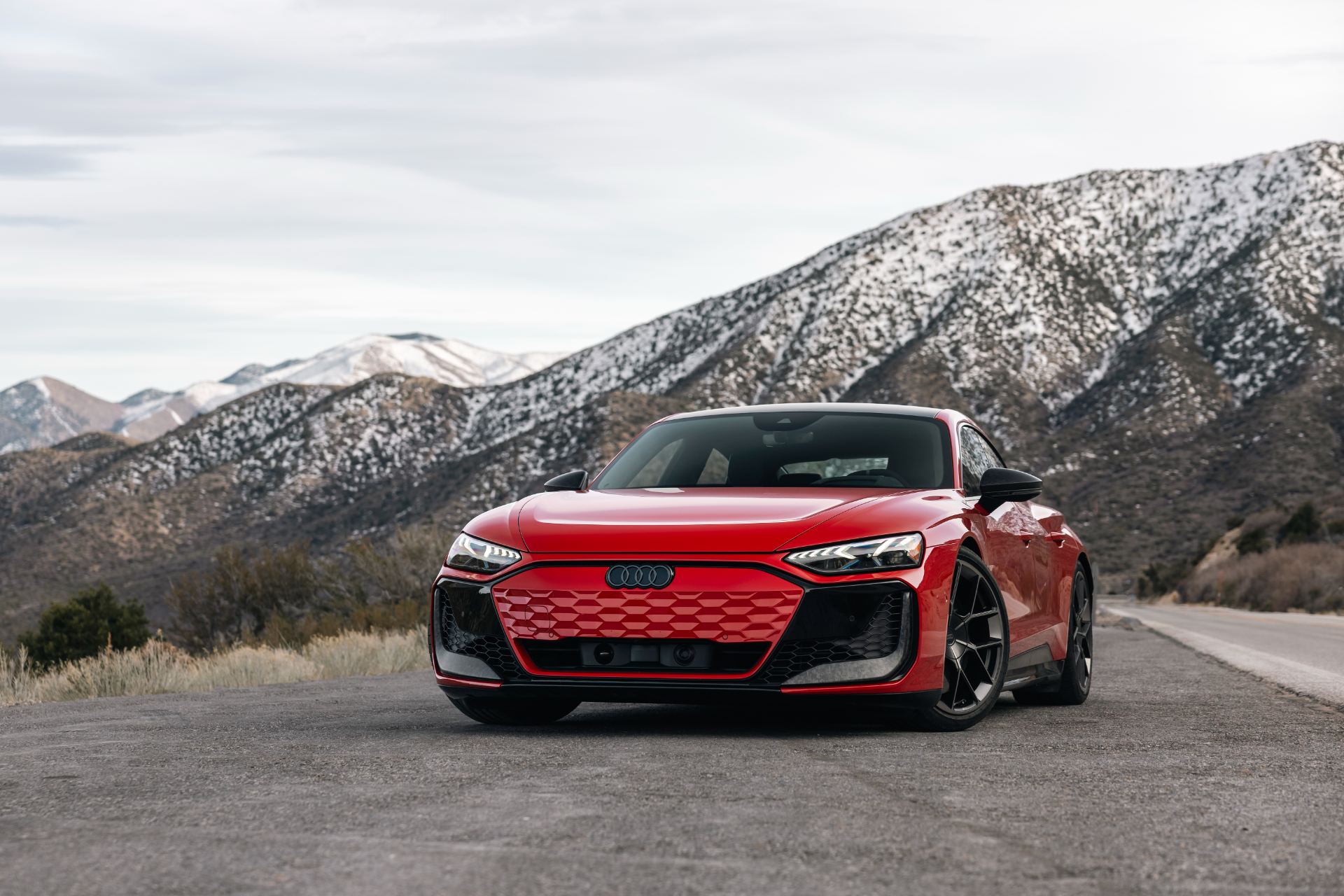2026 audi rs e tron gt performance front snowy mountains red