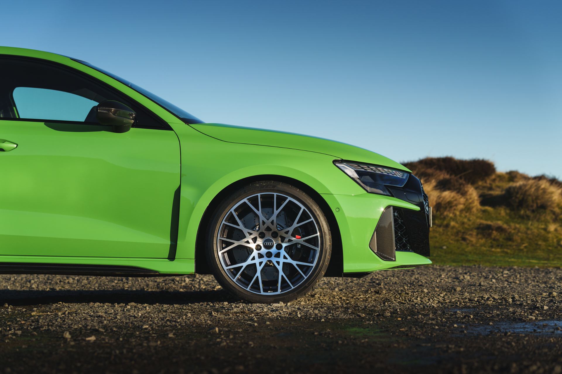 2025 audi rs 3 sportback front quarter side detail green