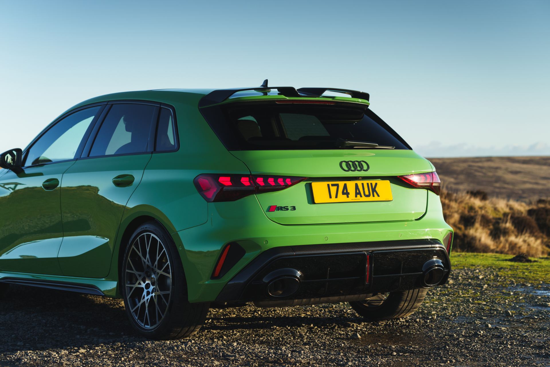 2025 audi rs 3 sportback rear three quarter close green