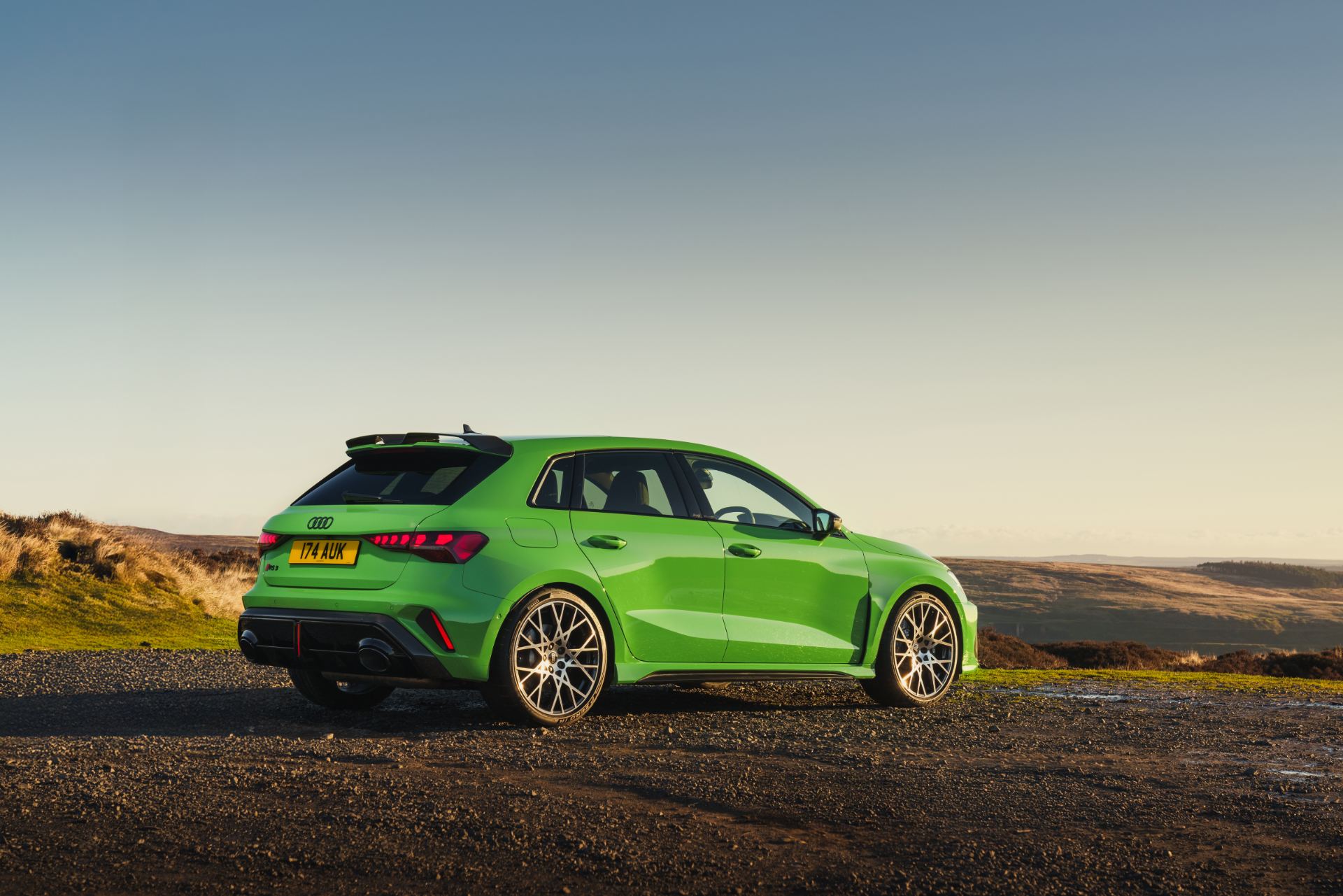 2025 audi rs 3 sportback rear three quarter moorland green