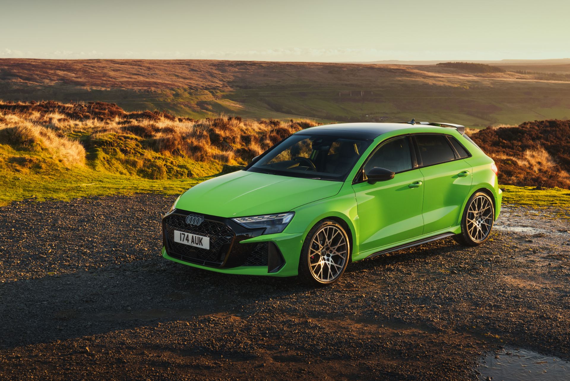 2025 audi rs 3 sportback front three quarter moorland green