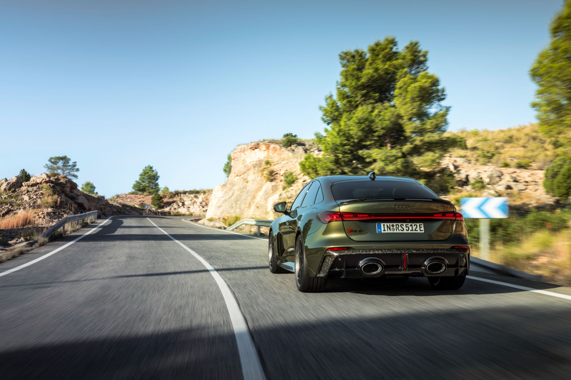 2026 audi rs 5 driving rear road green