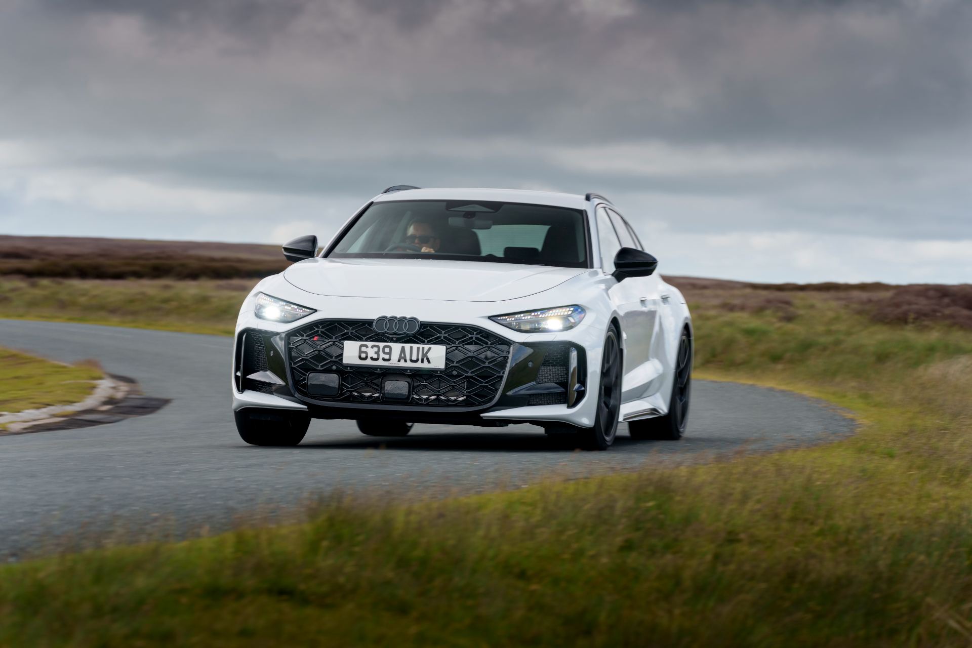2026 audi rs 5 avant driving front three quarter bend white