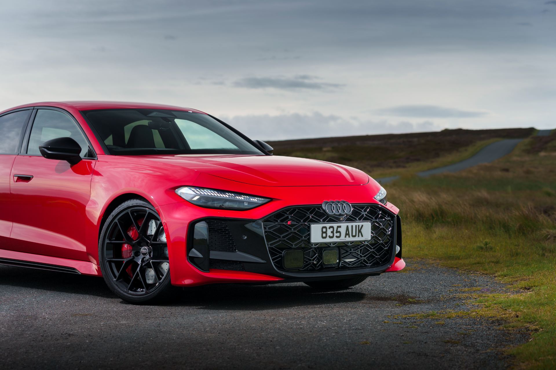 2026 audi rs 5 saloon front three quarter close moorland red
