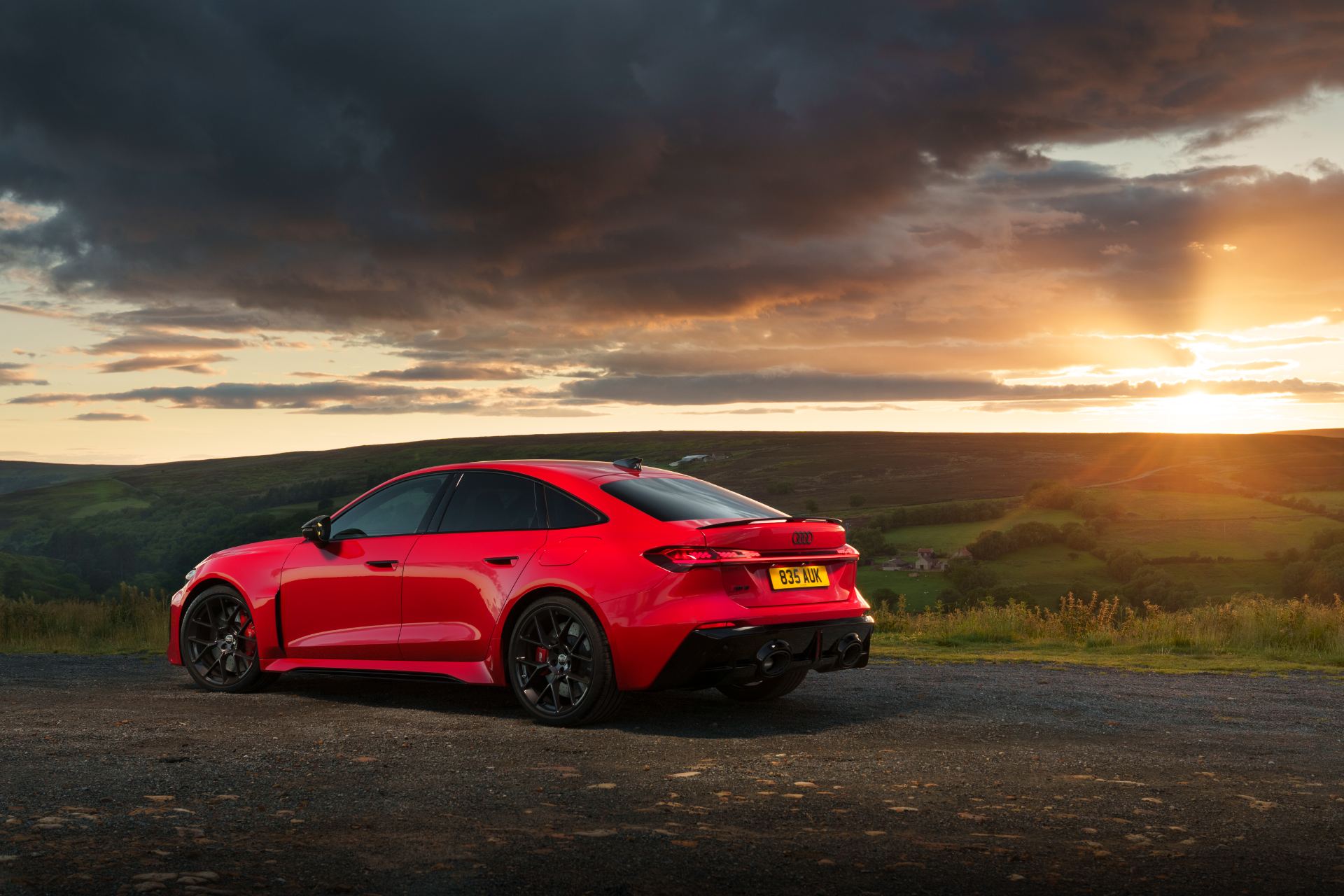 2026 audi rs 5 saloon rear three quarter sunset red