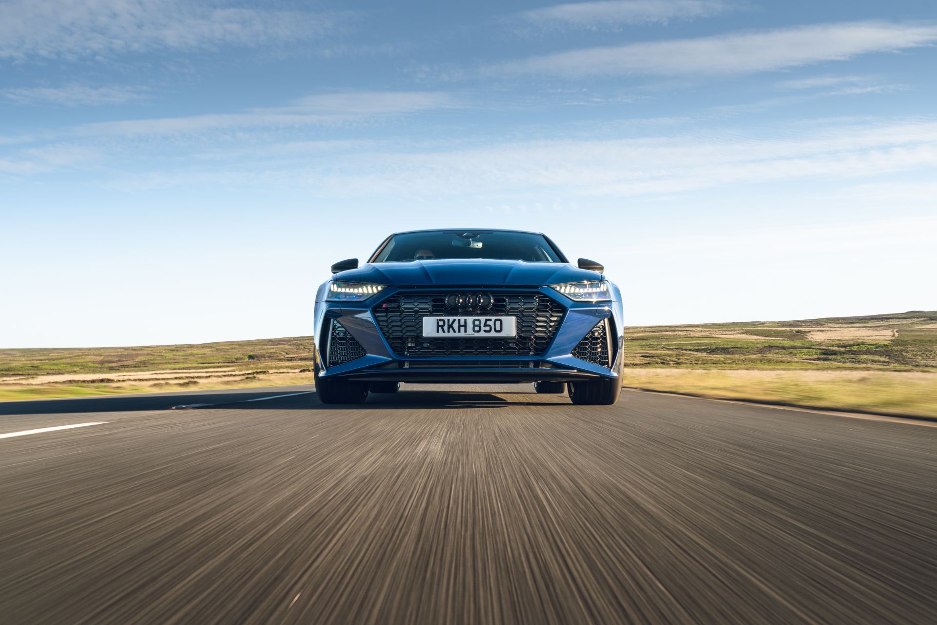 2025 audi rs 7 sportback performance driving front road blue