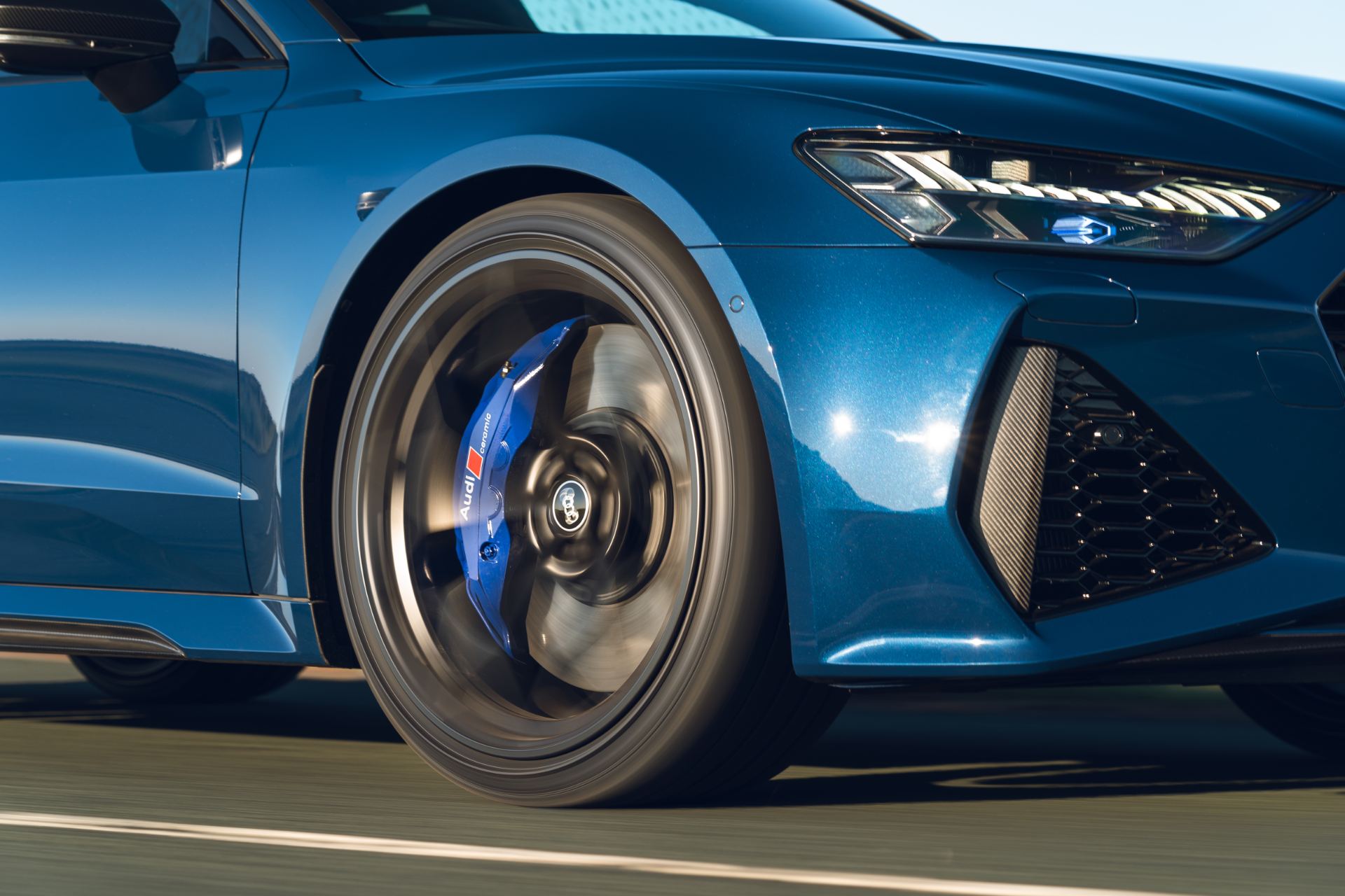 2025 audi rs 7 sportback performance front quarter driving blue caliper