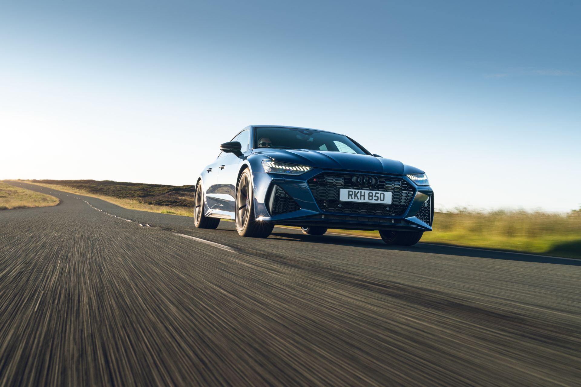 2025 audi rs 7 sportback performance driving front three quarter blue