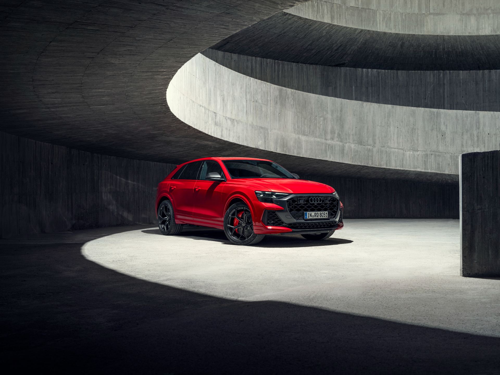 2027 audi rs q8 performance front three quarter spiral ramp red