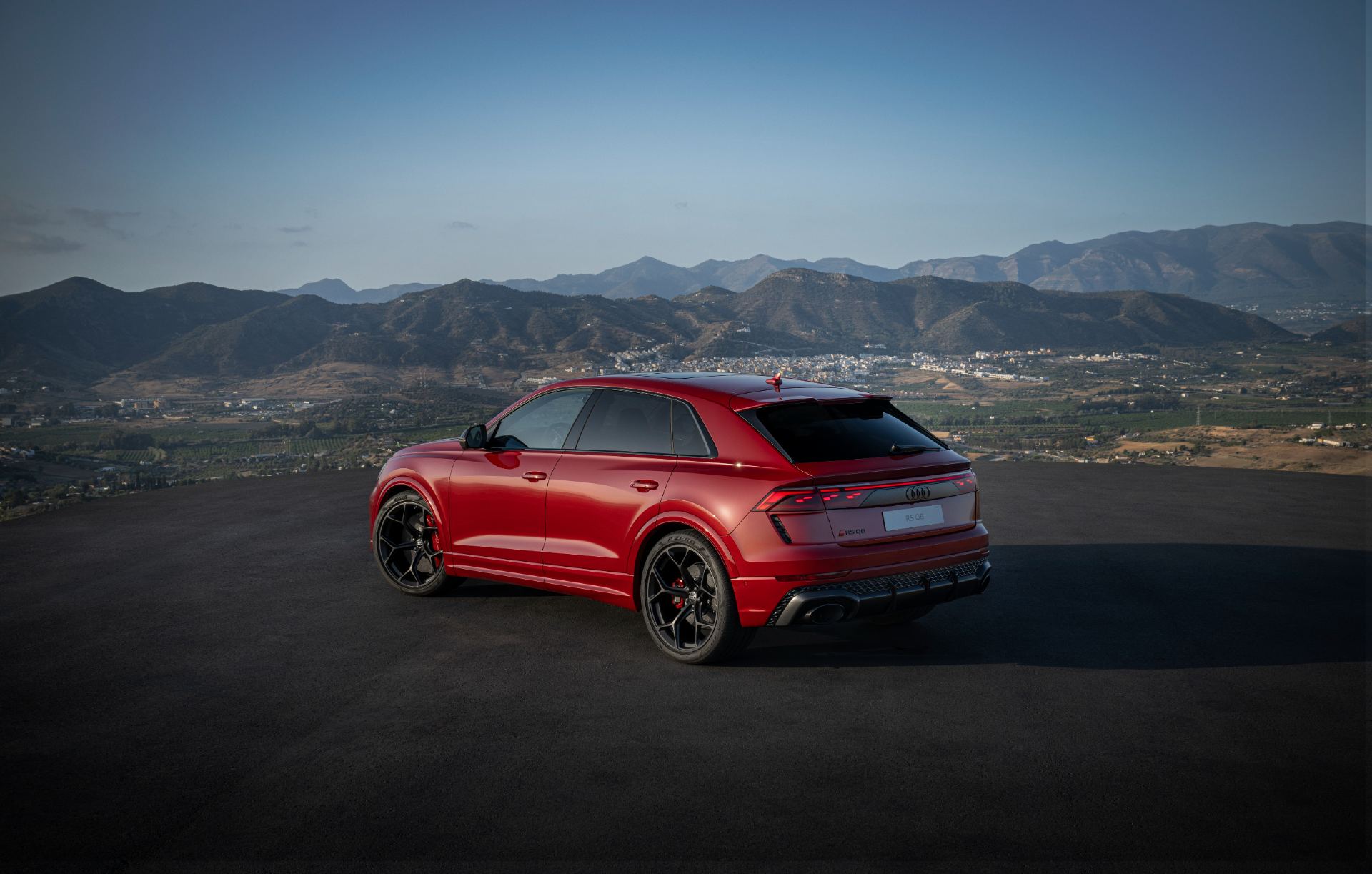2027 audi rs q8 performance rear three quarter mountains red