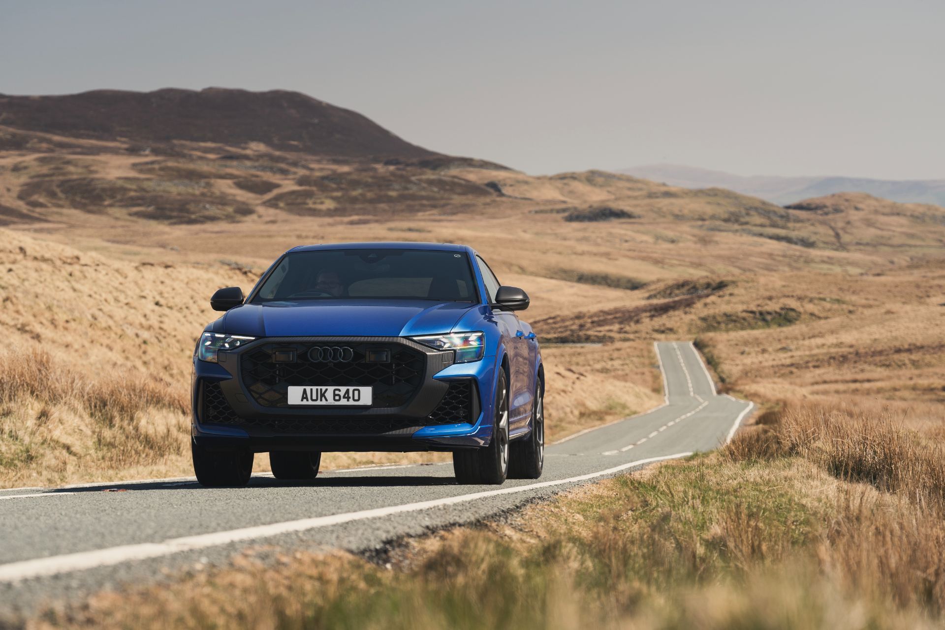 2026 audi rs q8 performance driving front winding road blue