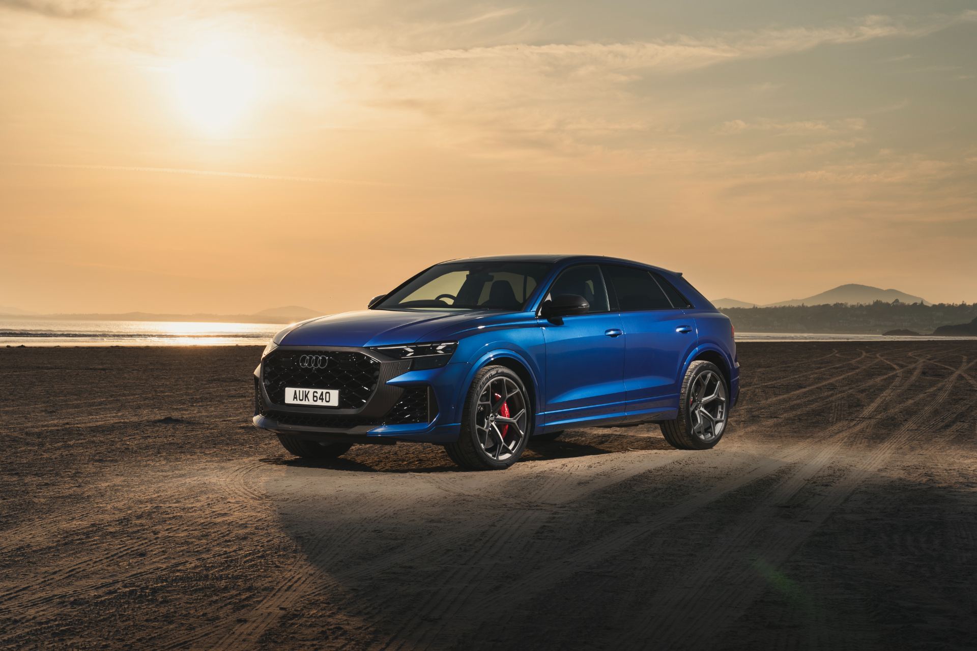 2026 audi rs q8 performance front three quarter sunset blue