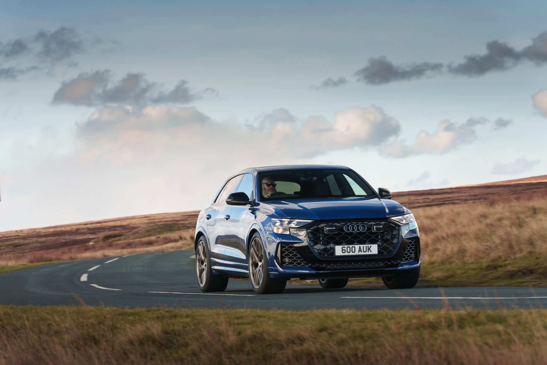 2026 audi rs q8 driving front three quarter blue
