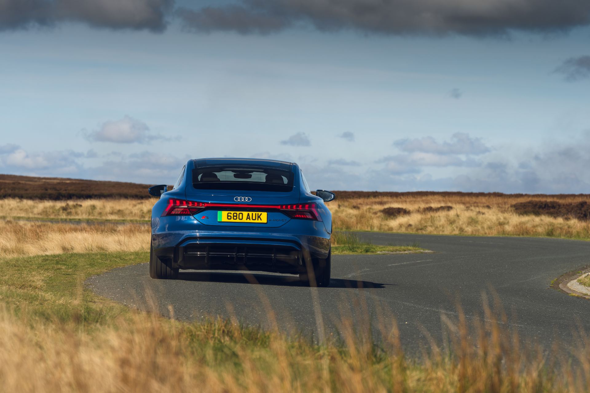 2026 audi s e tron gt quattro driving rear bend blue